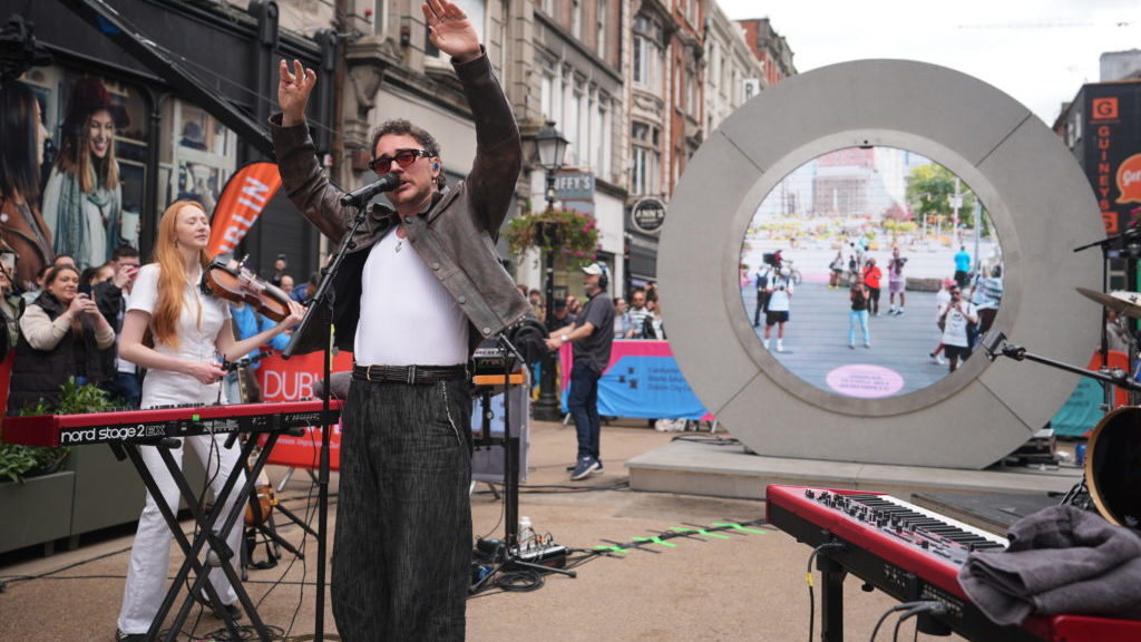 Cian Ducrot and Flash Mob Choir performing at Dublin portal streaming live to New York, Vilnius and Lublin, © PA Wire/PA Images