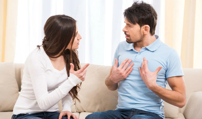 A young couple arguing.