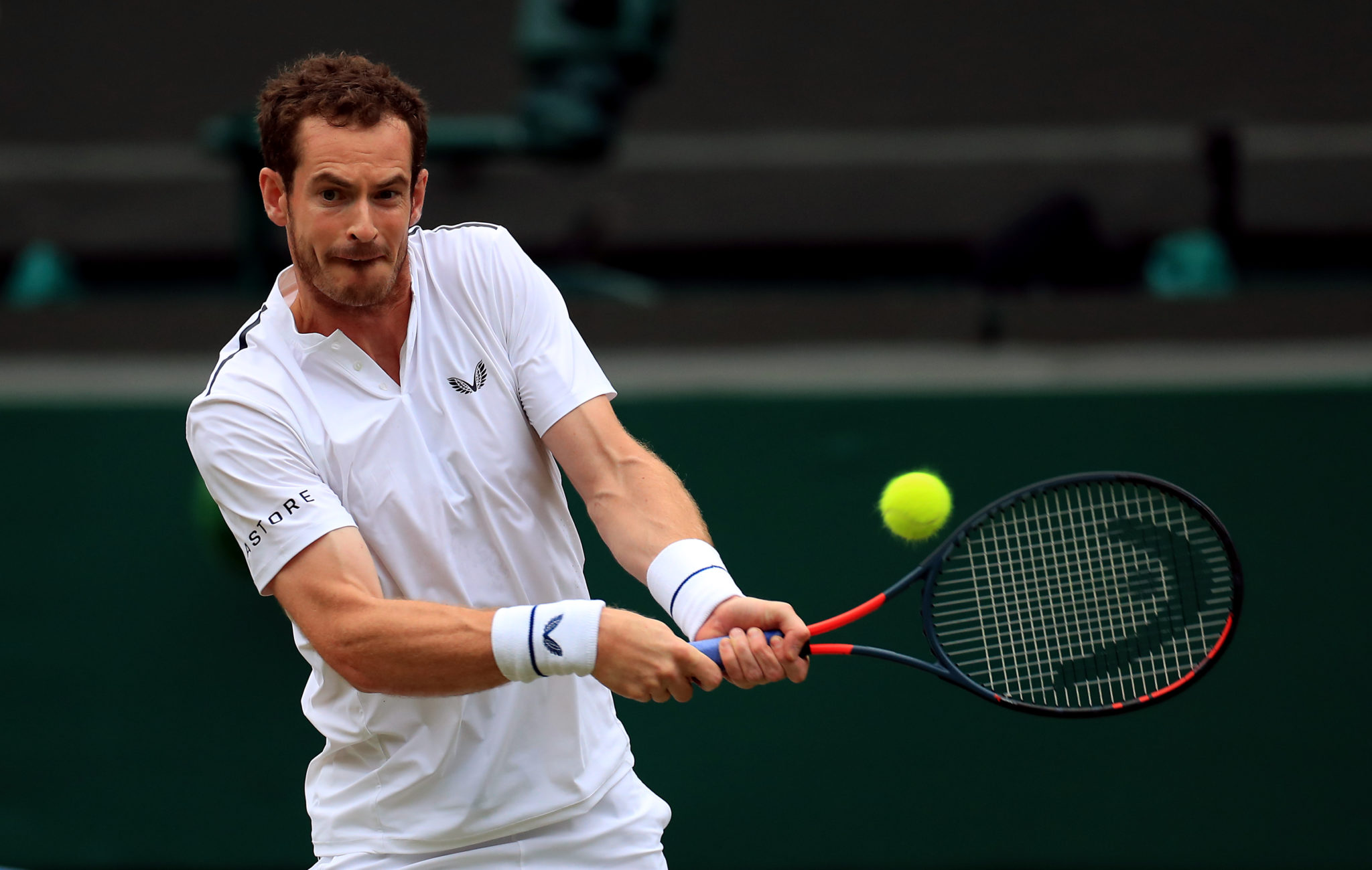 Andy Murray strikes a ball during a match.