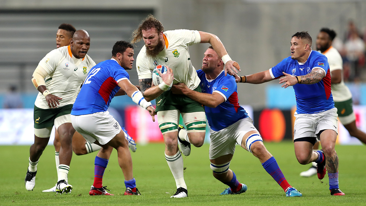 South Africa's RG Snyman goes through Namibia's Peter John Walters and Johan Retief during the 2019 Rugby World Cup match at the City of Toyota Stadium in Japan