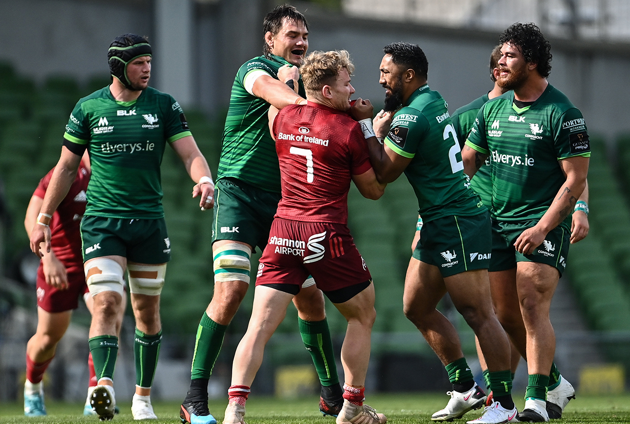 Chris Cloete of Munster tussles with Quinn Roux, left, and Bundee Aki of Connacht during the Guinness PRO14 Round 15 match between Munster and Connacht at the Aviva Stadium in Dublin