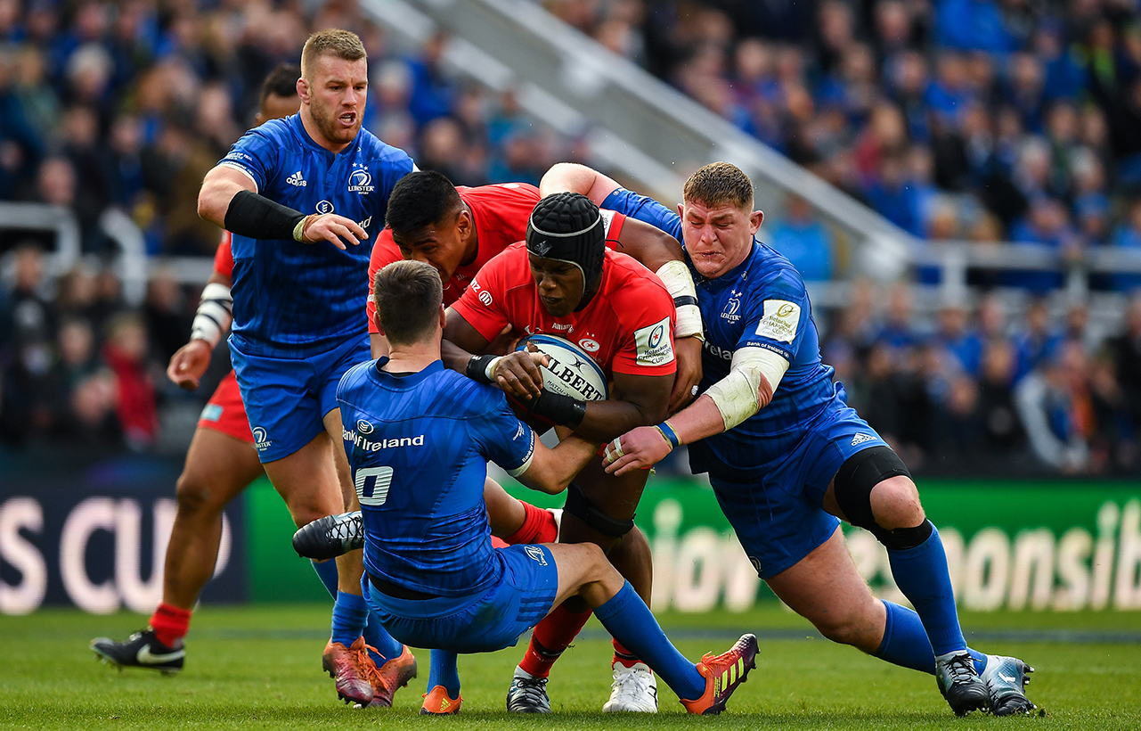 Maro Itoje of Saracens is tackled by Jonathan Sexton and Tadhg Furlong of Leinster during the Heineken Champions Cup Final match between Leinster and Saracens at St James' Park in Newcastle Upon Tyne