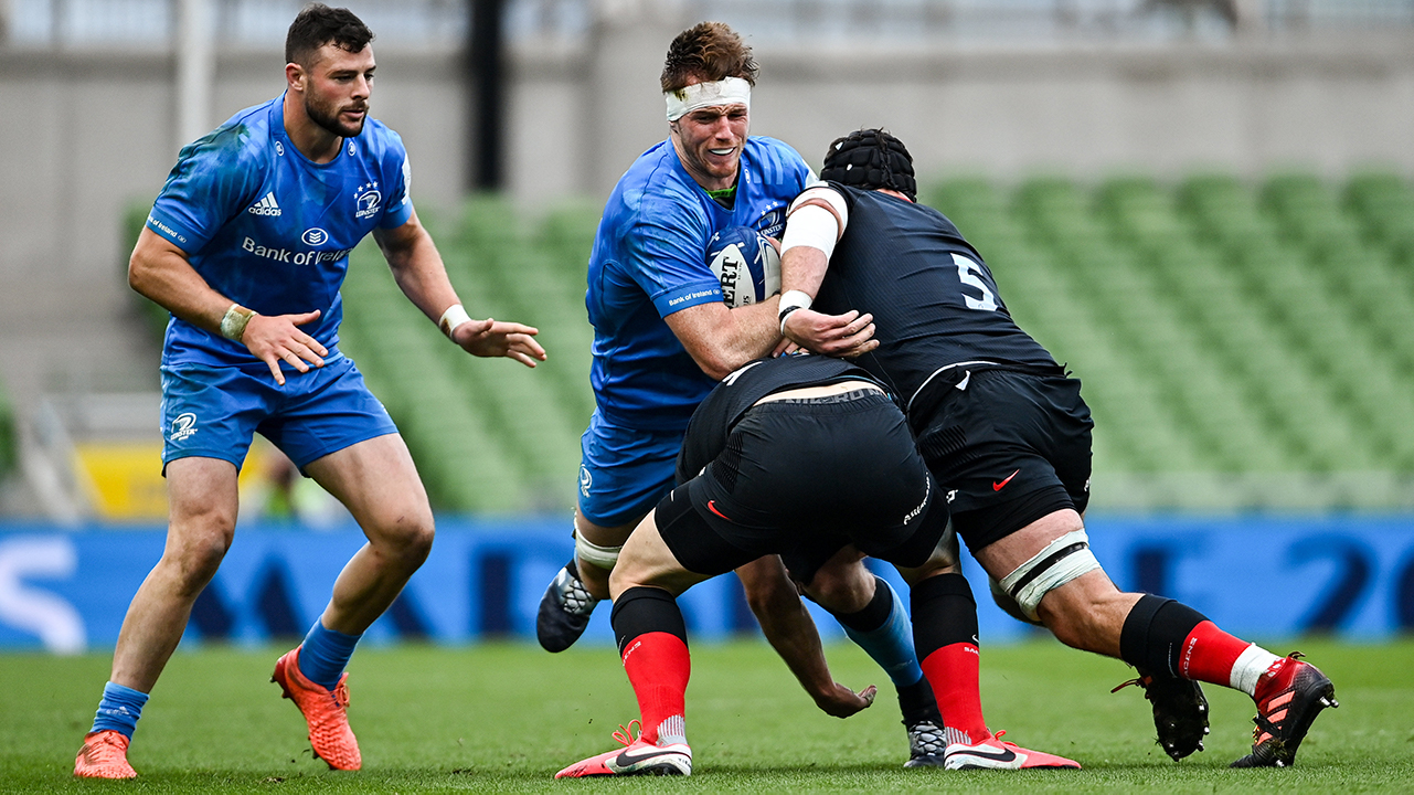 Ryan Baird of Leinster is tackled by Duncan Taylor, left, and Tim Swinson of Saracens during the Heineken Champions Cup Quarter-Final match between Leinster and Saracens at the Aviva Stadium in Dublin