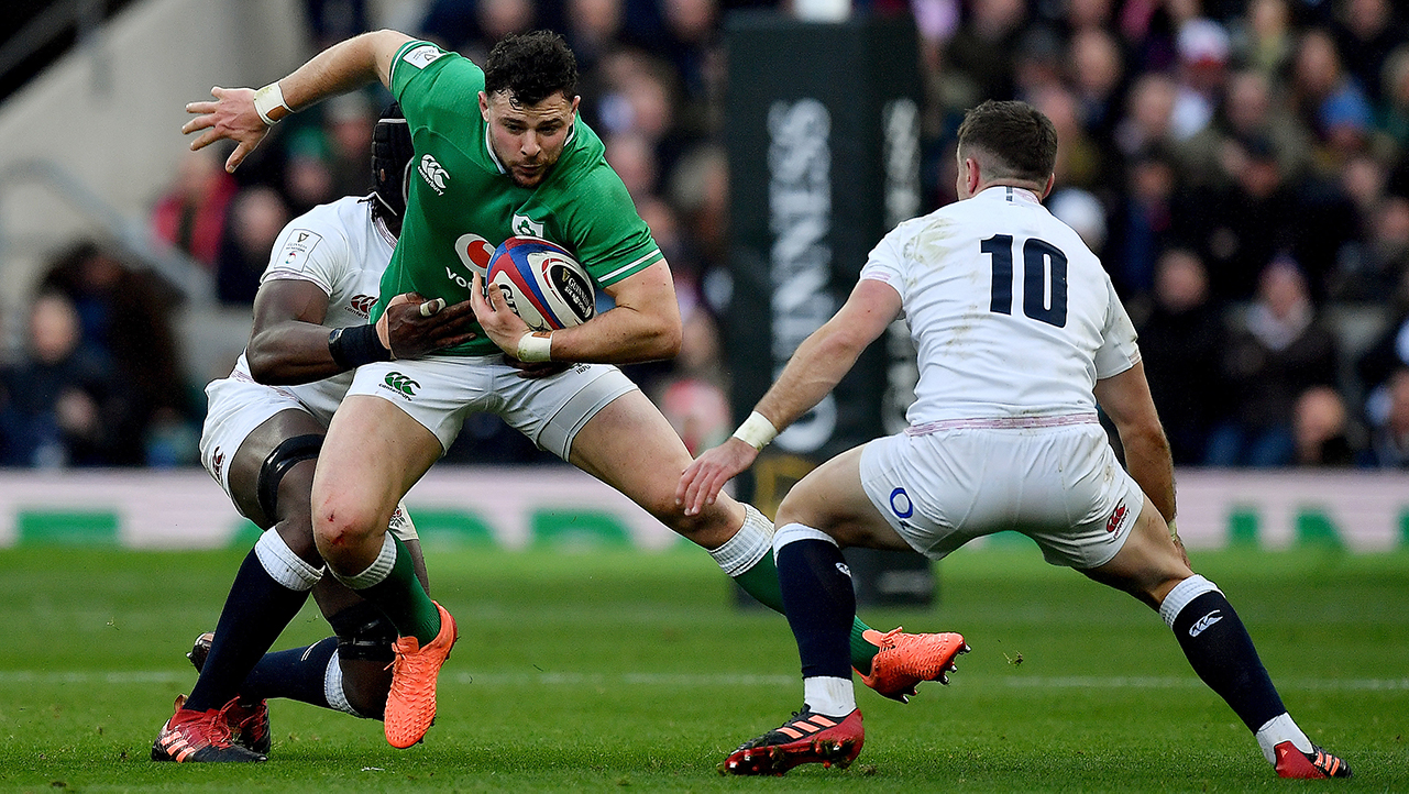 Robbie Henshaw of Ireland in action against Maro Itoje and George Ford of England during the Guinness Six Nations Rugby Championship match between England and Ireland at Twickenham Stadium in London, England