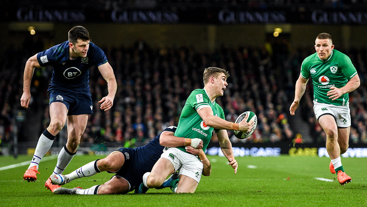 Garry Ringrose looks to offload to his Ireland team-mate Andrew Conway while being tackled by Ali Price of Scotland during the Guinness Six Nations Rugby Championship match between Ireland and Scotland at the Aviva Stadium in Dublin