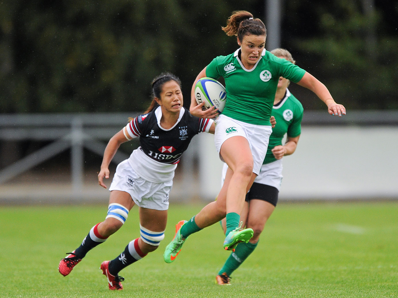 Louise Galvin, Ireland, is tackled by Wai Sum Sham, Hong Kong. Women's Sevens Rugby Tournament, Pool C, Ireland v Hong Kong. UCD, Belfield, Dublin