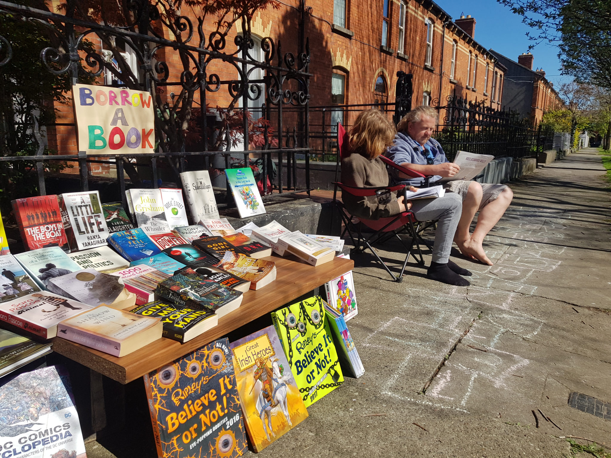 File photo of Ronan Fox with his son Oisín with a ‘borrow a book’ stall they set up outside their home during lockdown