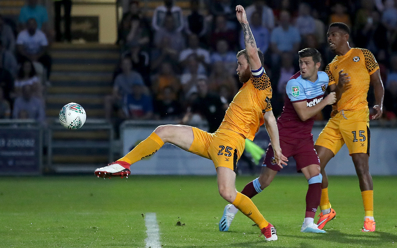 Newport County's Mark O'Brien nearly scores during the Carabao Cup Second Round match at Rodney Parade, Newport.