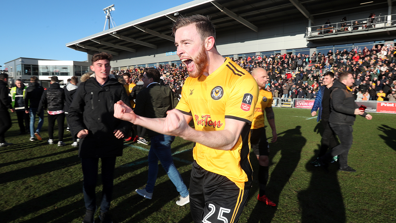 Newport County's Mark O'Brien celebrates victory after the Emirates FA Cup, Third Round match at Rodney Parade, Newport.