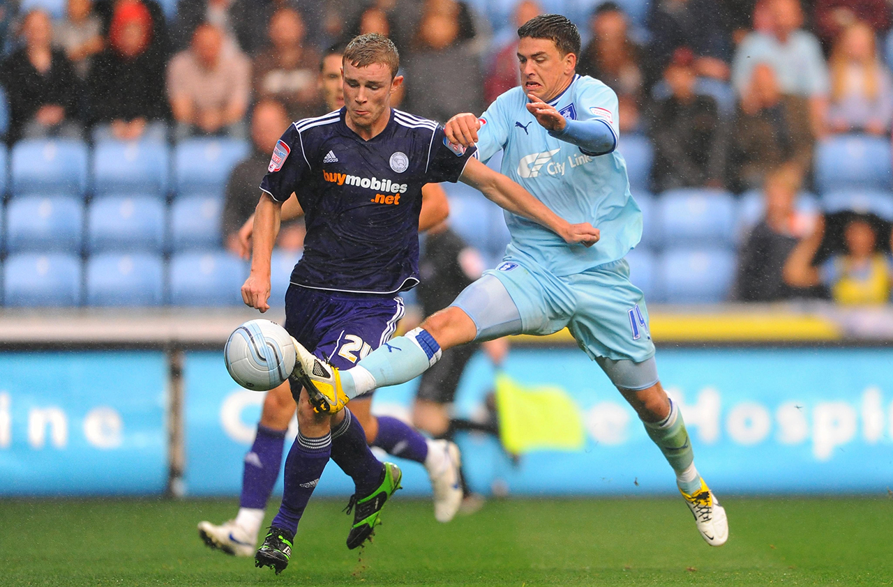 Coventry City's Cody McDonald and Derby County's Mark O'Brien (left) battle for the ball during the npower Football League Championship match at the Ricoh Arena, Coventry.