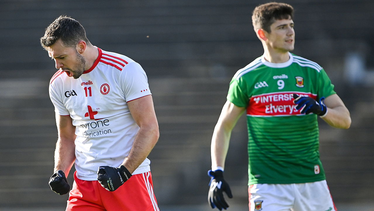 Conor McKenna of Tyrone celebrates scoring his side's first goal as Conor Loftus of Mayo looks on during the Allianz Football League Division 1 Round 7 match between Mayo and Tyrone at Elverys MacHale Park in Castlebar, Mayo.