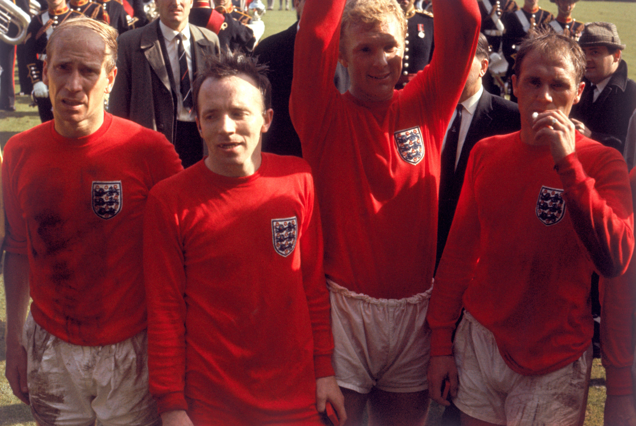 (L-R) Exhausted England players Bobby Charlton, Nobby Stiles, Bobby Moore and Ray Wilson after the game