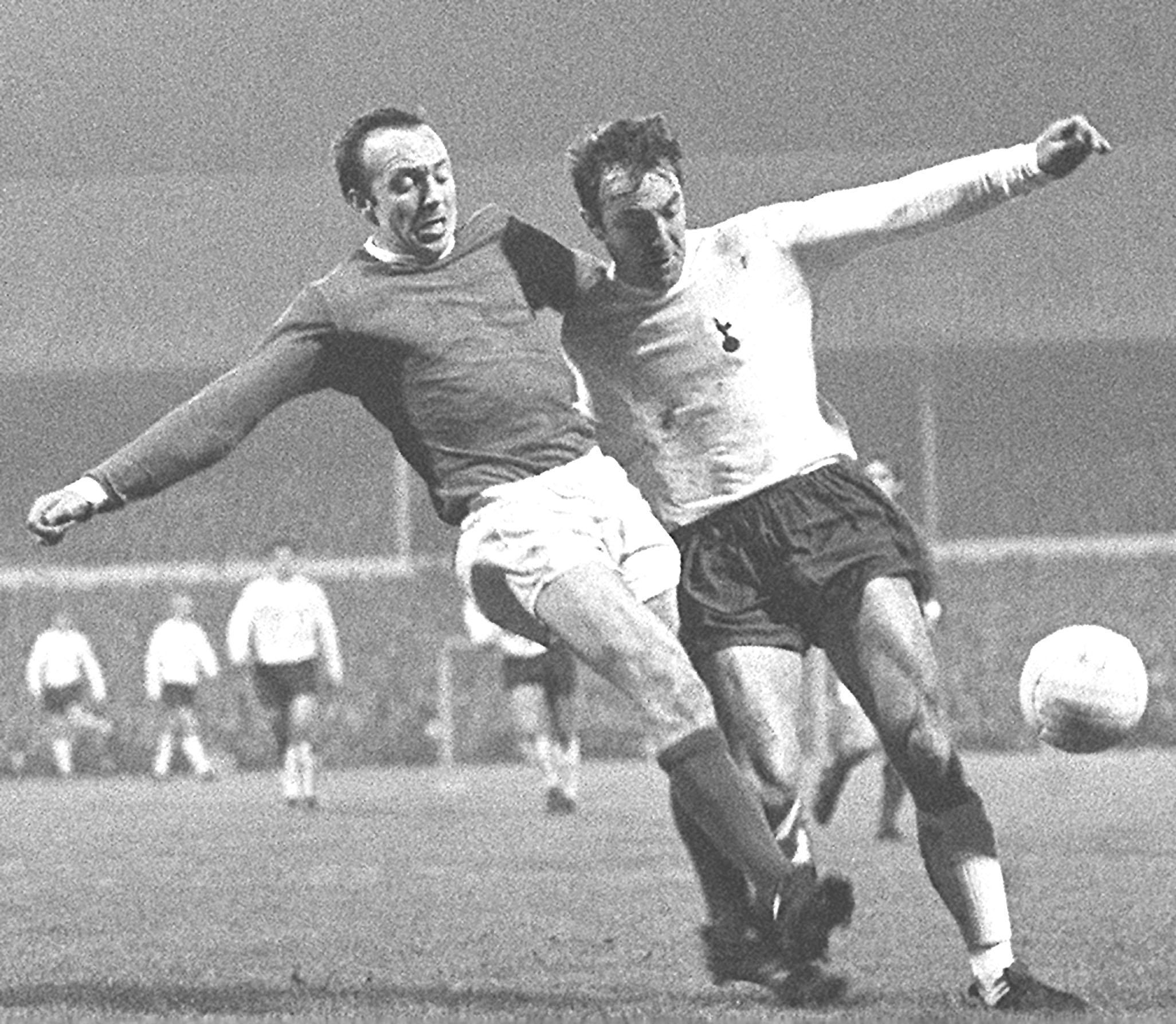 Manchester United's Nobby Stiles (left) and Tottenham Hotspur's Jimmy Greaves in a tussle for the ball during the First Division match at White Hart Lane, London.