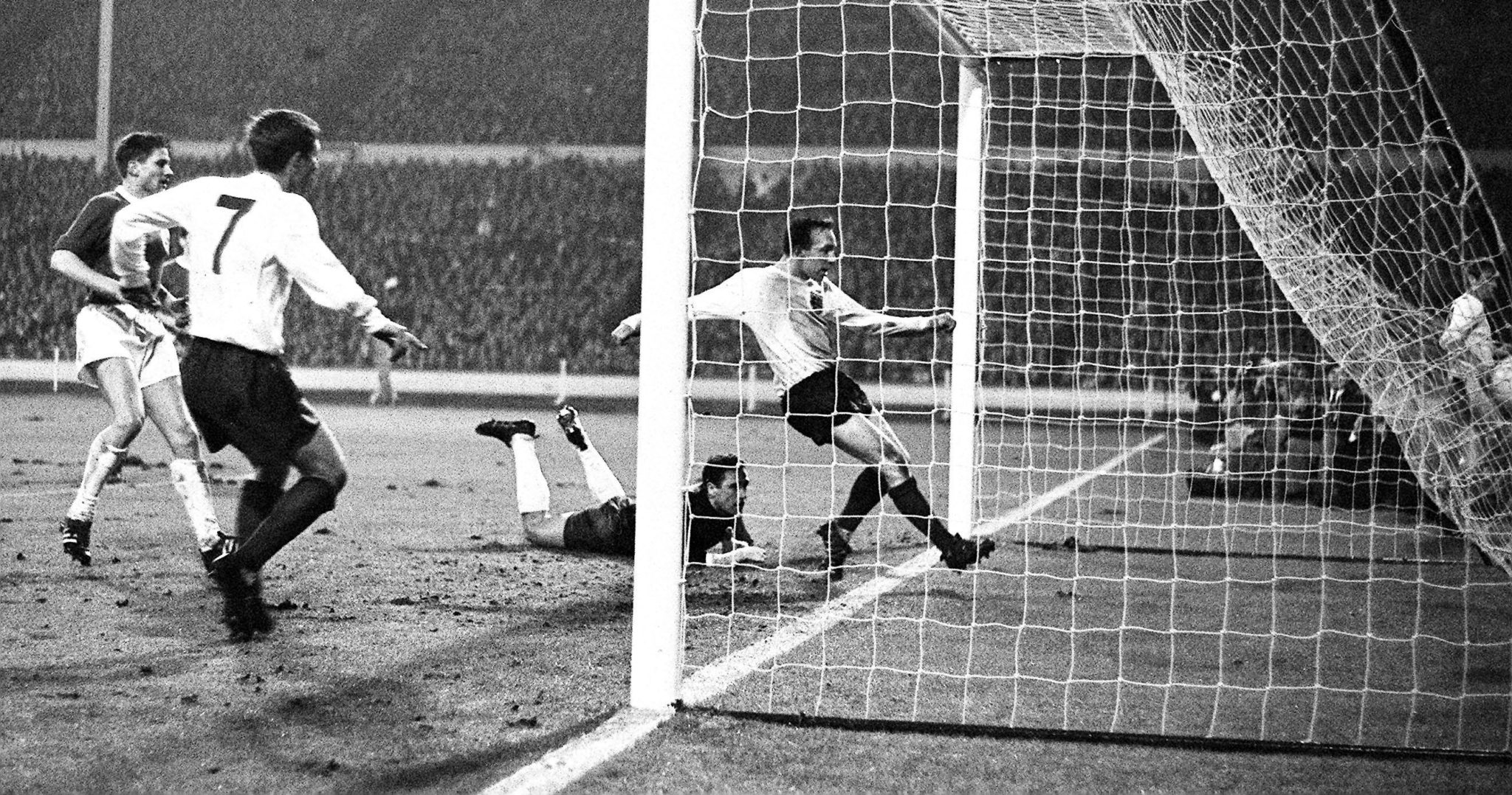 England's first goal scored by Nobby Stiles, a surprise choice centre-forward, in the international match against West Germany at Wembley. Also in picture is Alan Ball, England right winger (No 7).