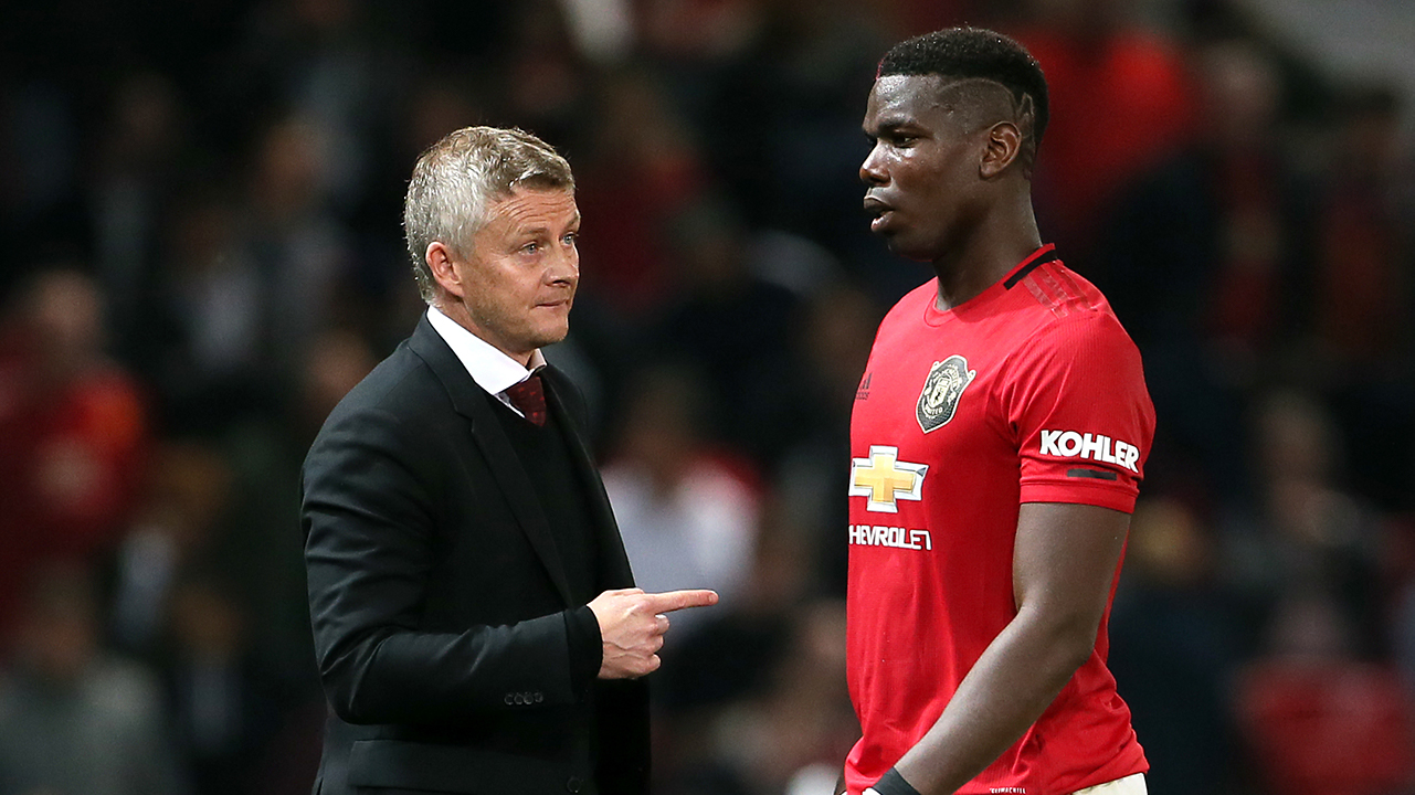 Manchester United manager Ole Gunnar Solskjaer (left) and Paul Pogba during the Carabao Cup, Third Round match at Old Trafford, Manchester.