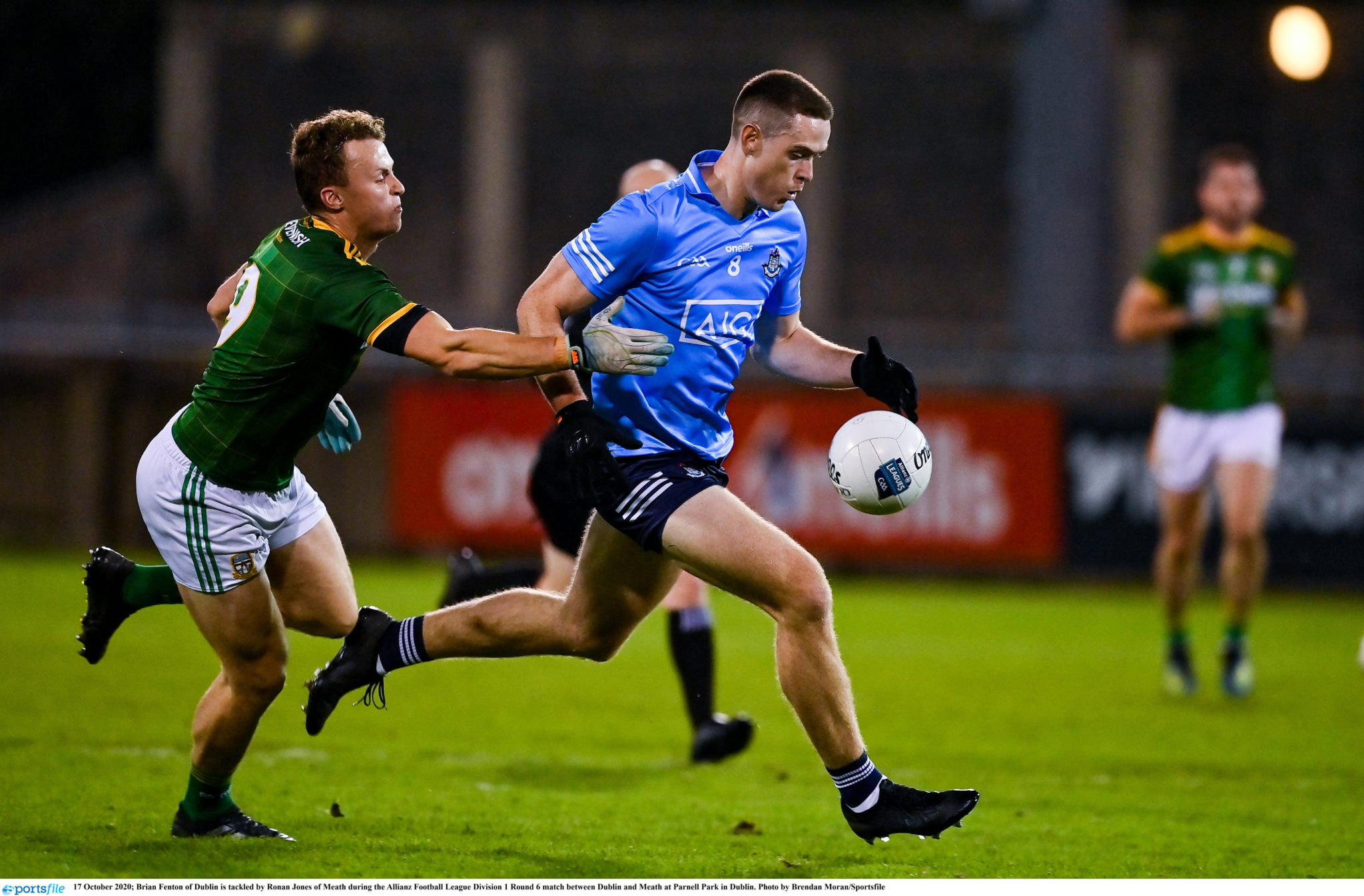 Brian Fenton drives with the ball against Meath