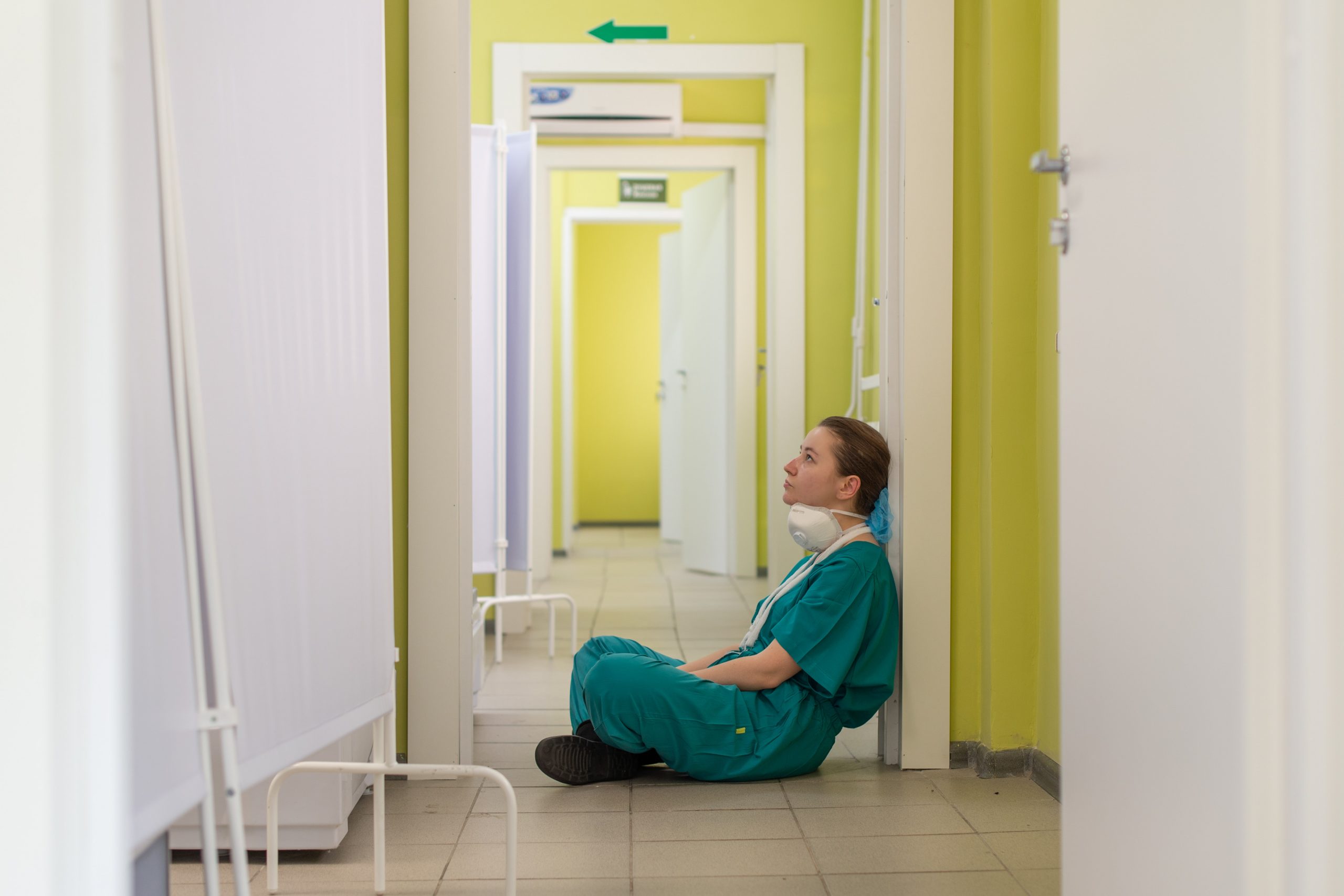 Nurse having a rest in a hallway.