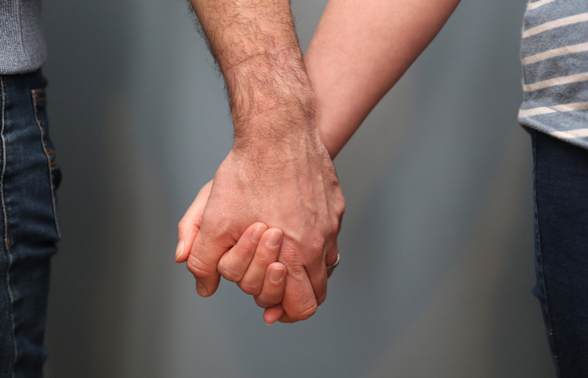 Couple holding hands