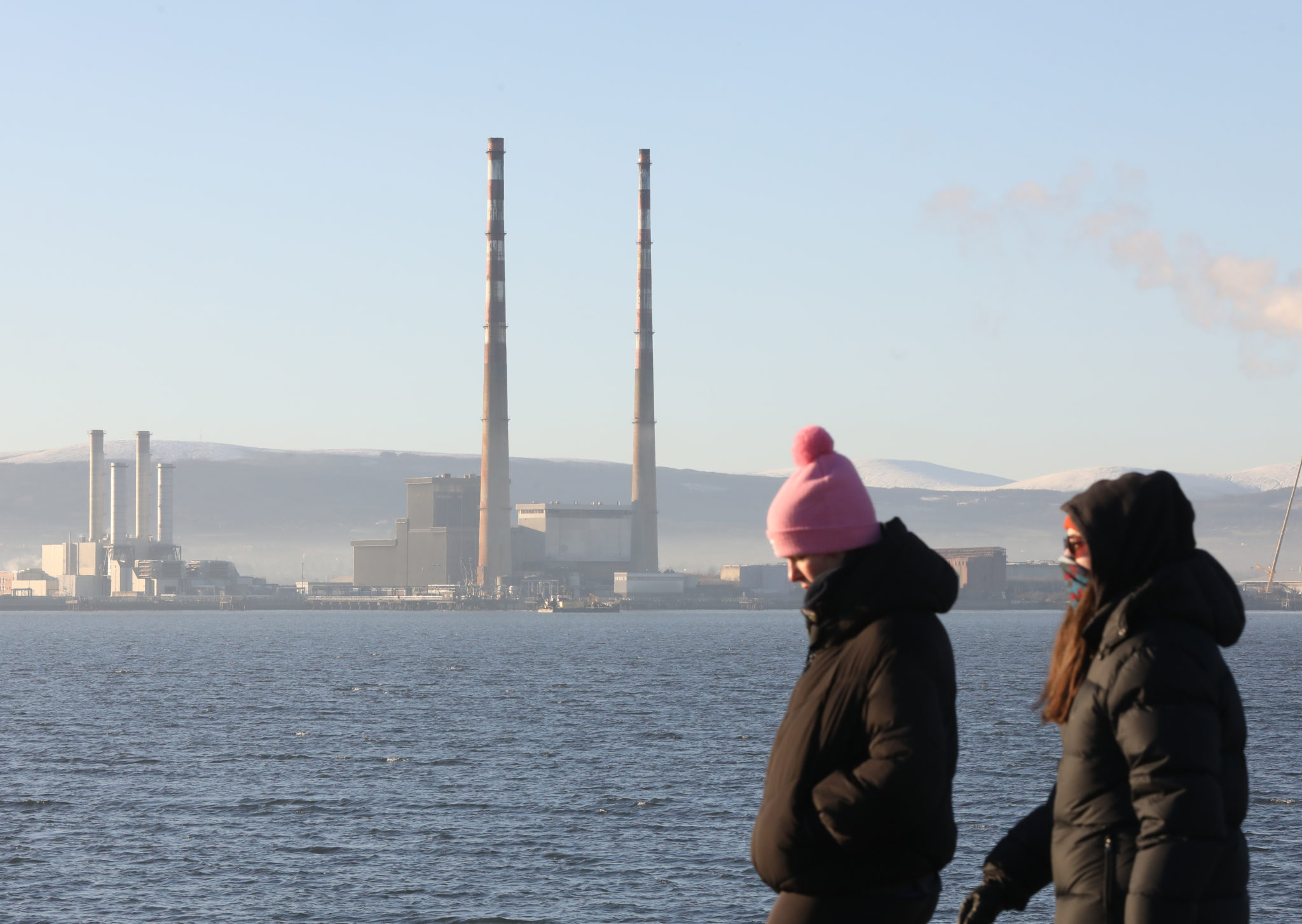 The Poolbeg power station chimneys with the snow-covered Dublin / Wicklow mountains in the background