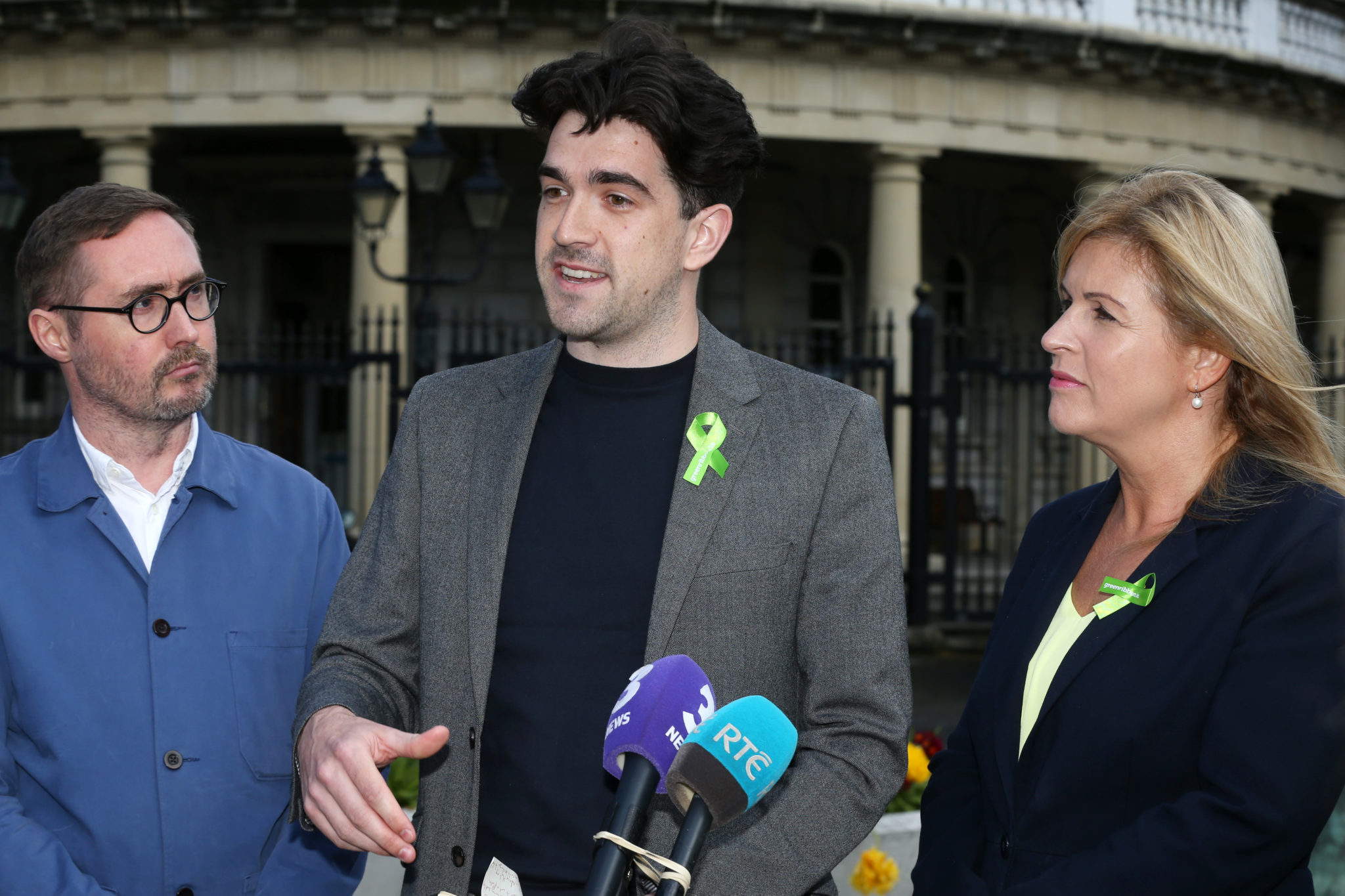 Sinn Féin Housing spokesperson Eoin Ó Broin with Senator Fintan Warfield and Senator Rose Conway Walsh talking to the media on the plinth at Leinster House