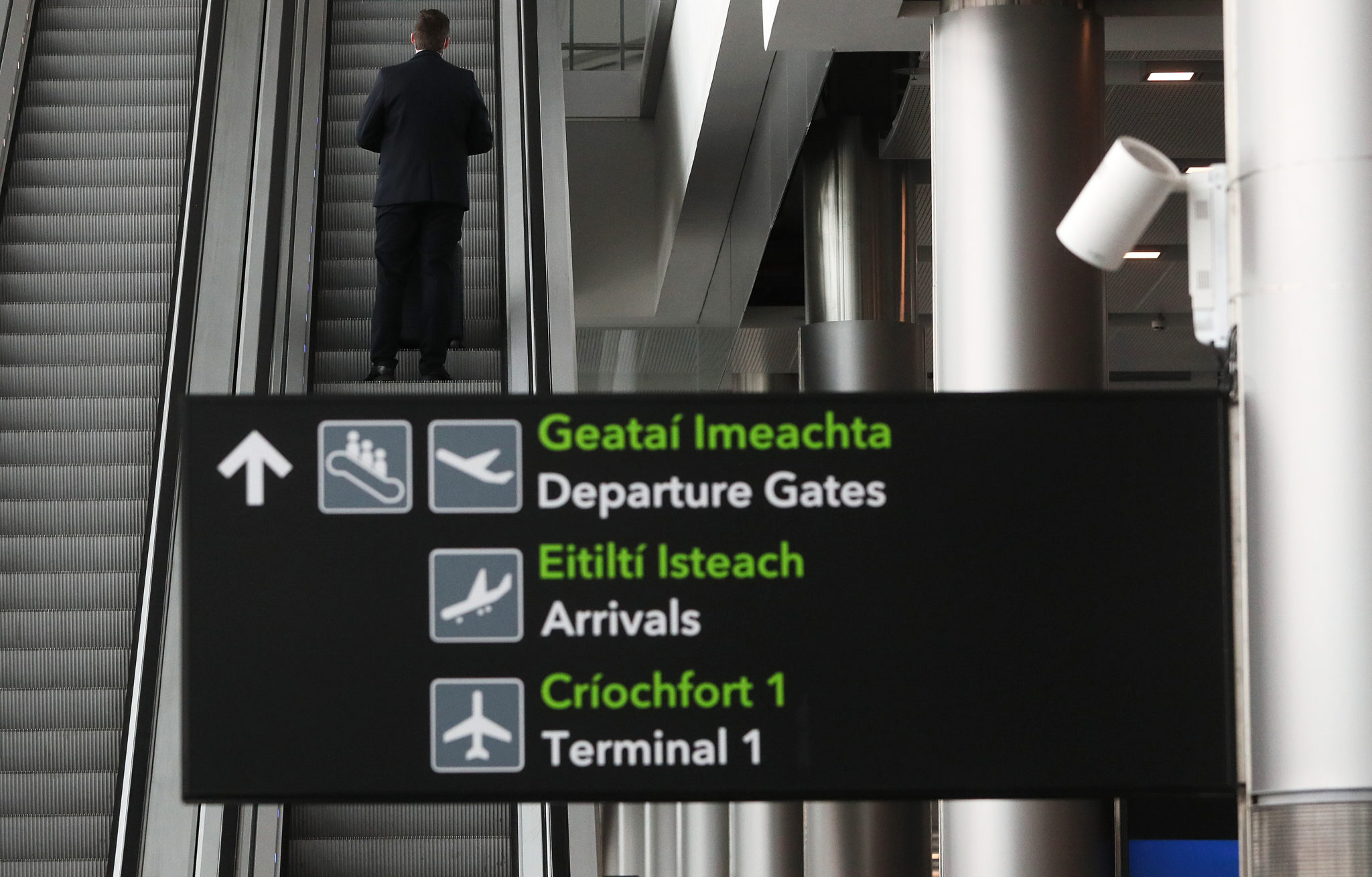 A man goes up an escalator in Terminal 2 at Dublin Airport