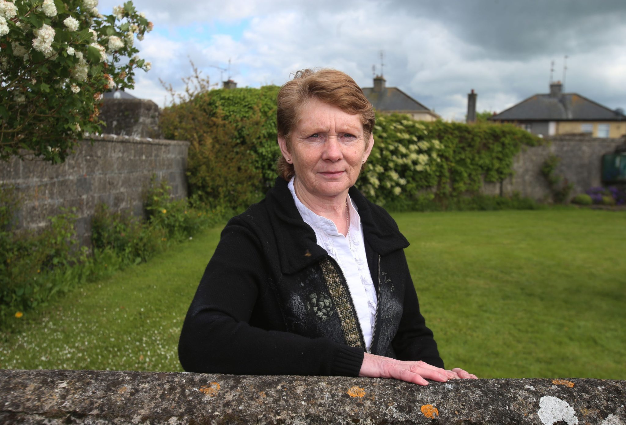Catherine Corless at the site of a mass grave for children who died in the Tuam Mother and Baby Home in Co Galway in 2014.