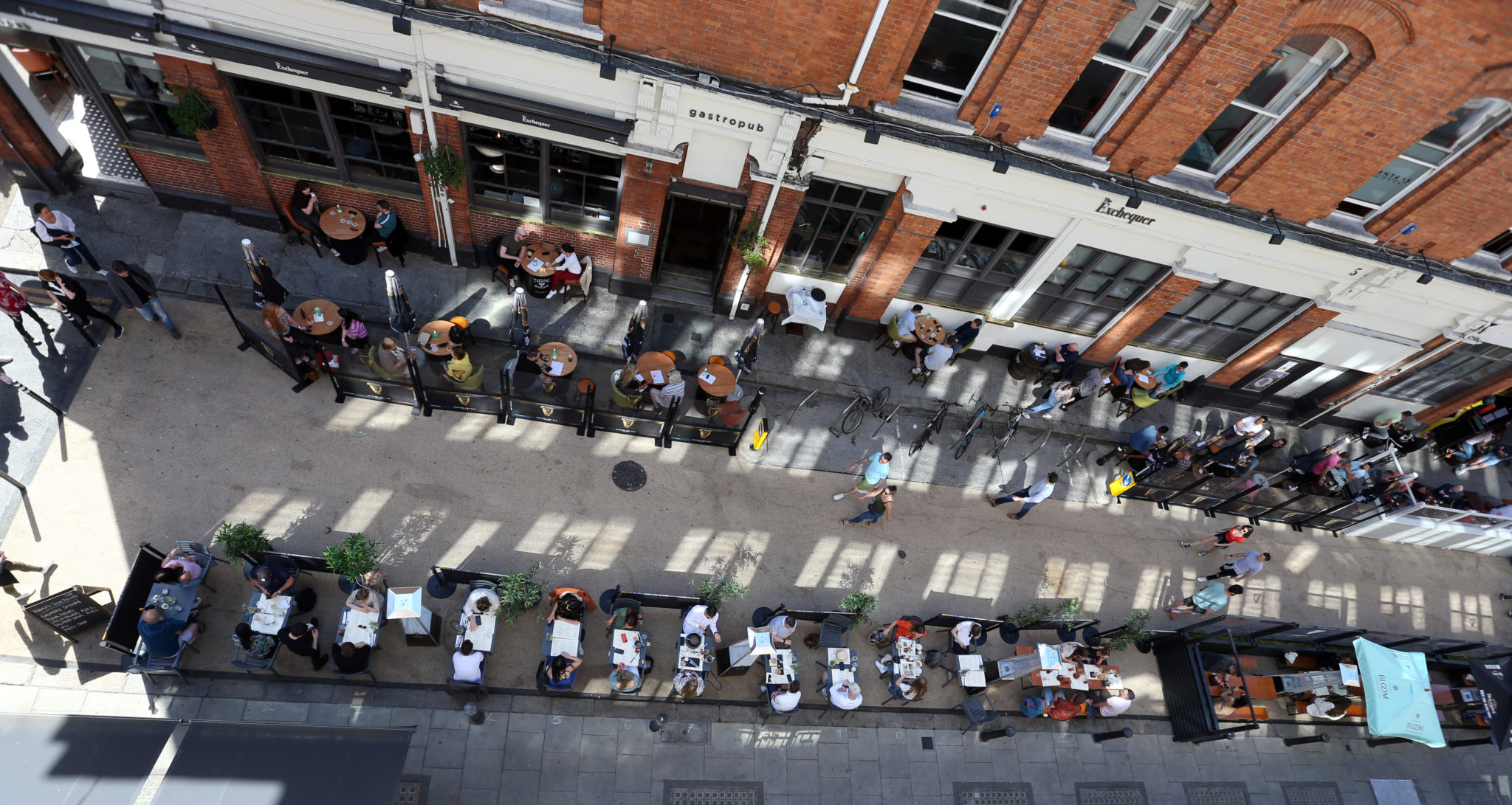 People enjoy outdoor dining on Exchequer Street in Dublin