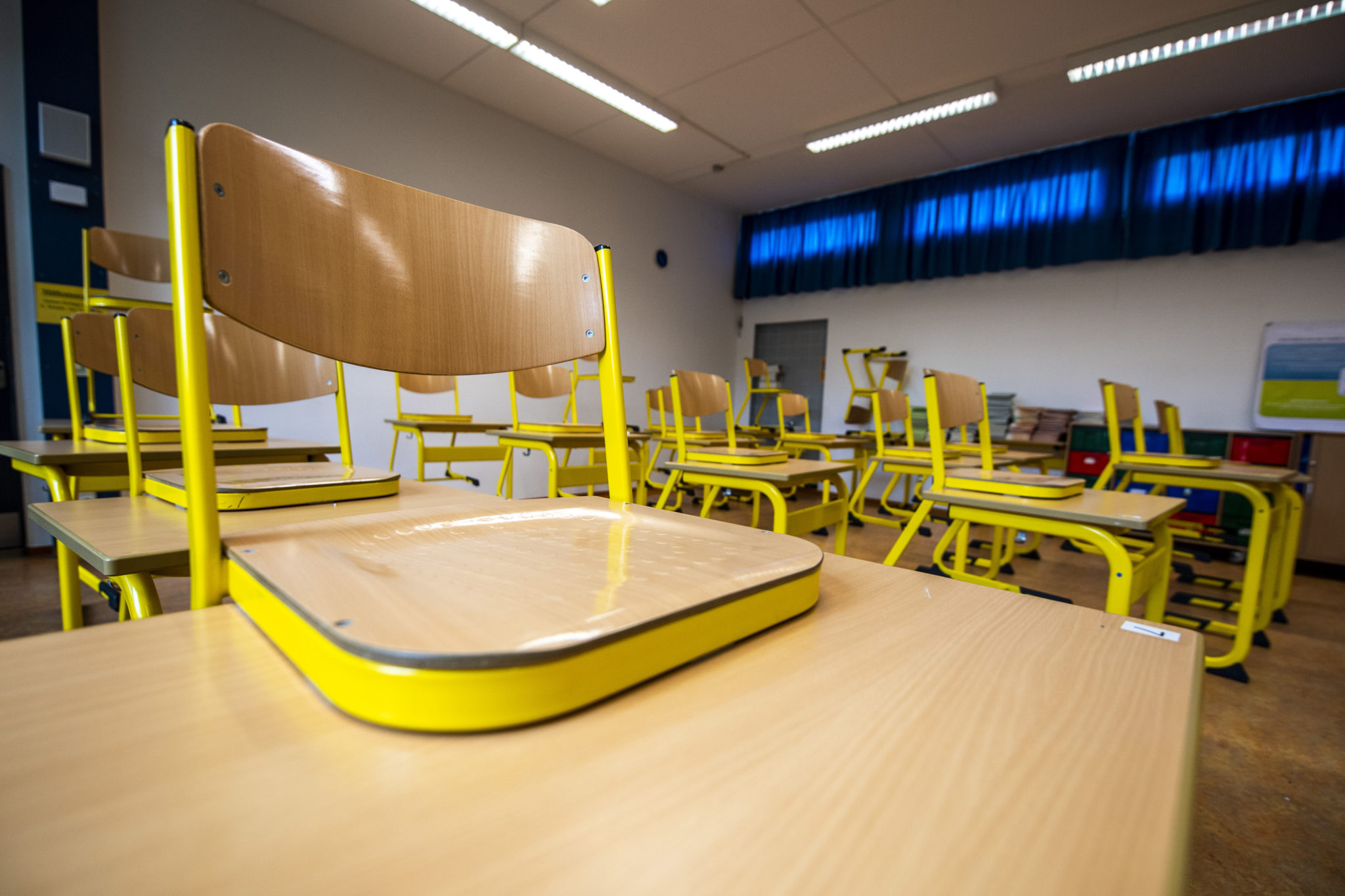 Chairs were placed on the desks in an empty classroom at the Freiherr-vom-Stein School in Gütersloh. 