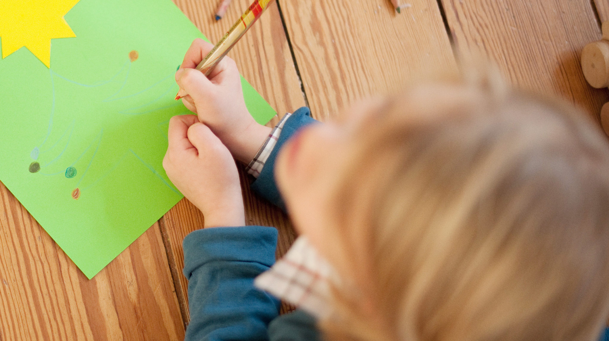 A child drawing on the floor. Image: Jan Haas/DPA/PA Images