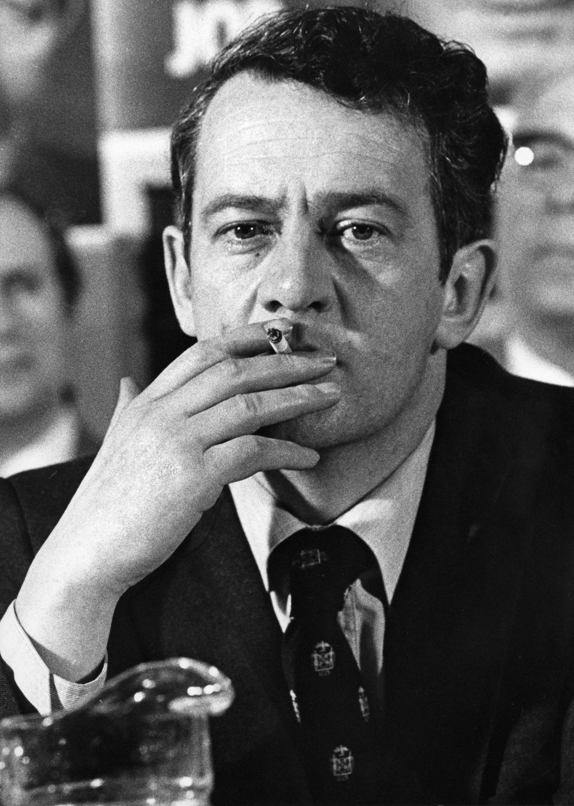 Des O'Malley smoking at a press conference in 1982