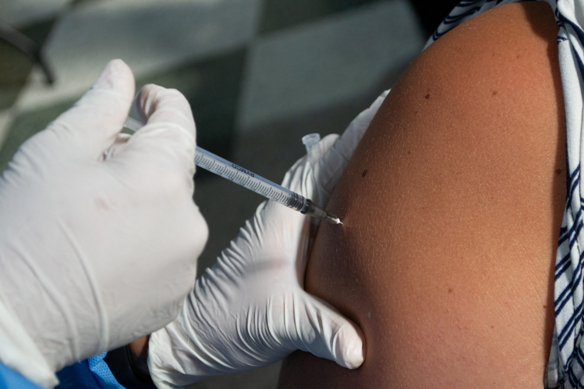 A women gets a dose of the Moderna COVID-19 vaccine in Bogota, Colombia in this file photo