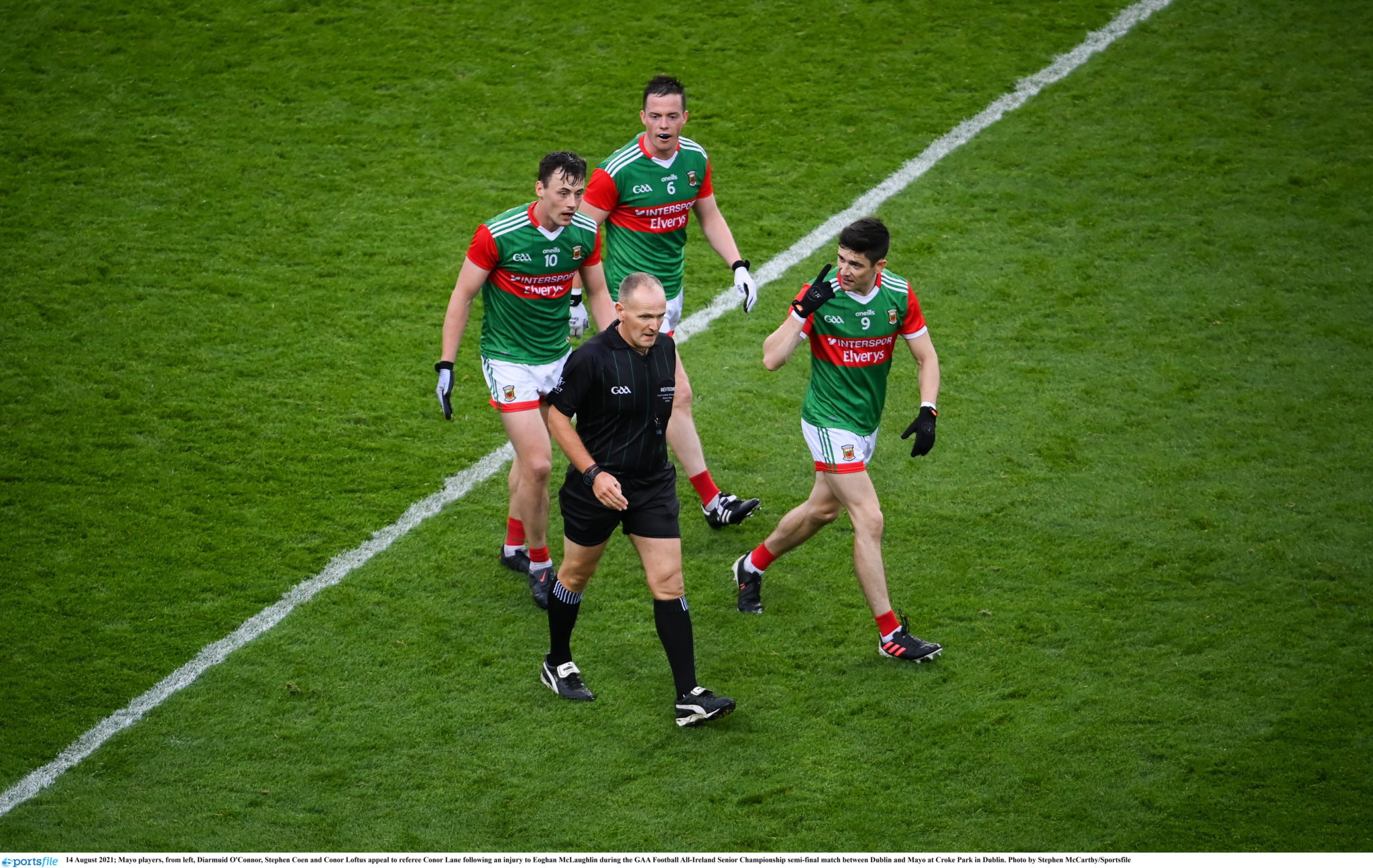 Mayo players protest referee's decision to not punish John Small