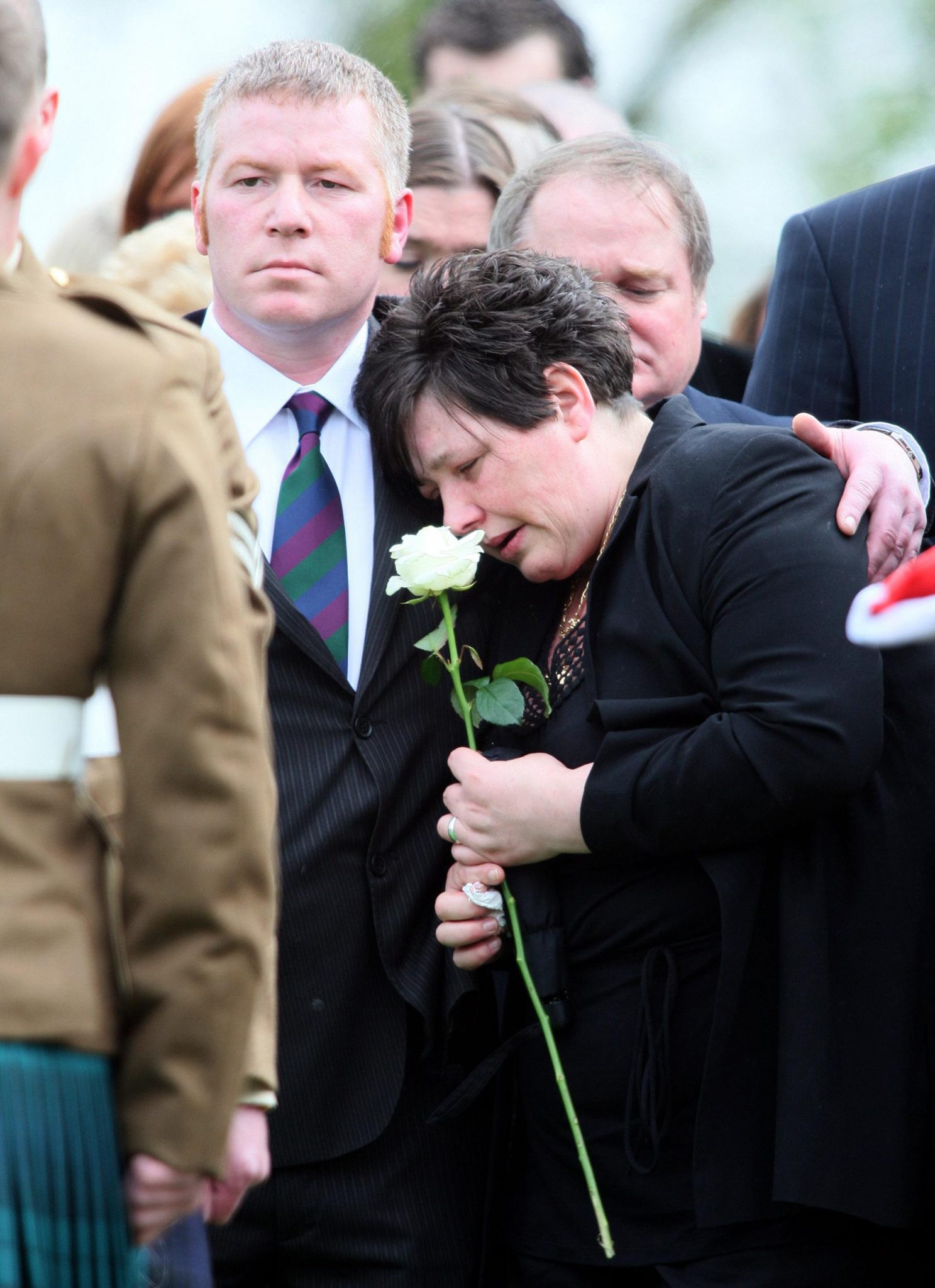 Allan and Janette Binnie during the burial of their son, Seán Binnie, at Roselawn Cemetery in Belfast, Northern Ireland in May 2009.