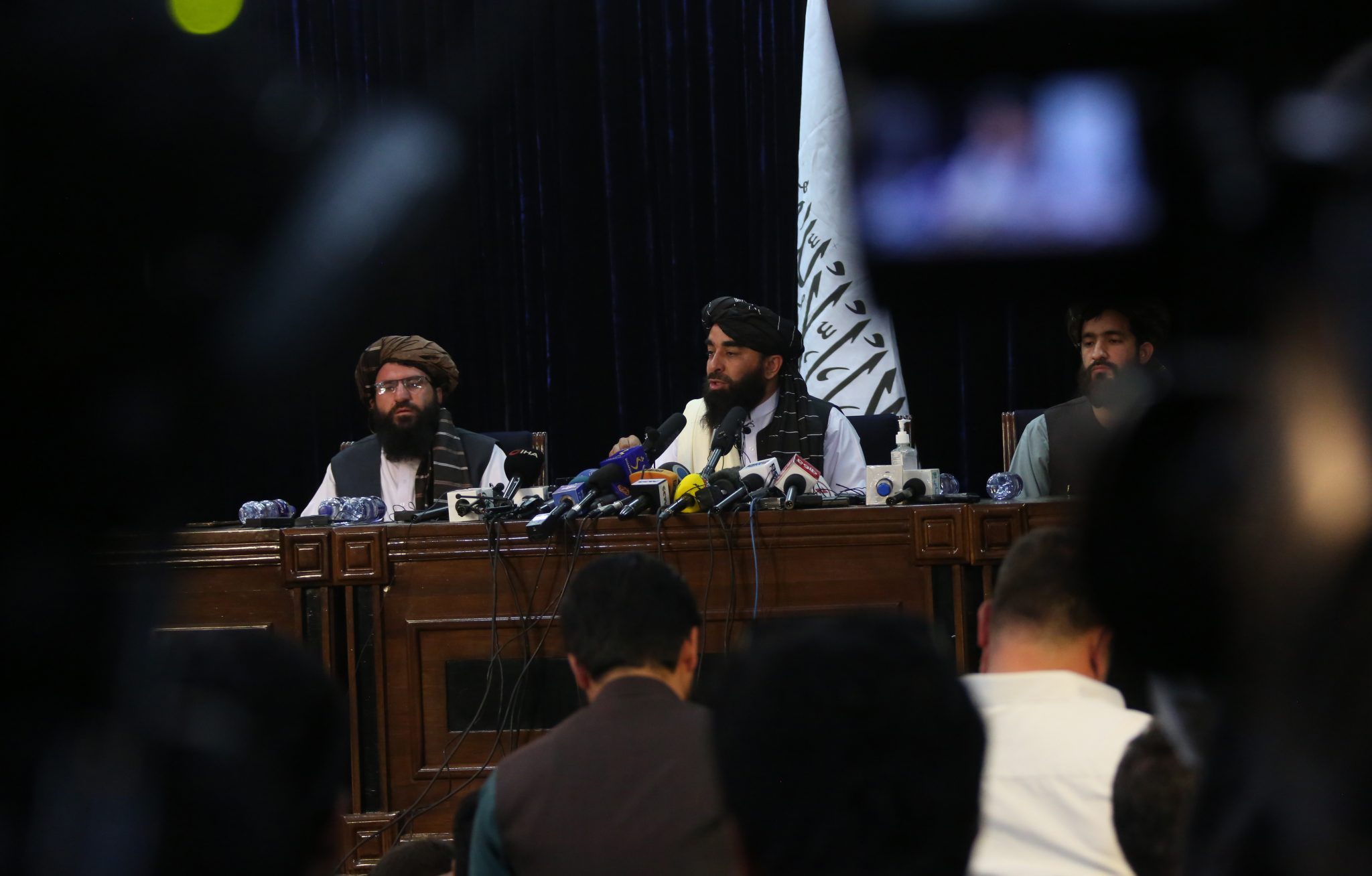 Taliban spokesman Zabihullah Mujahid (centre) attends a press conference in Kabul, Afghanistan