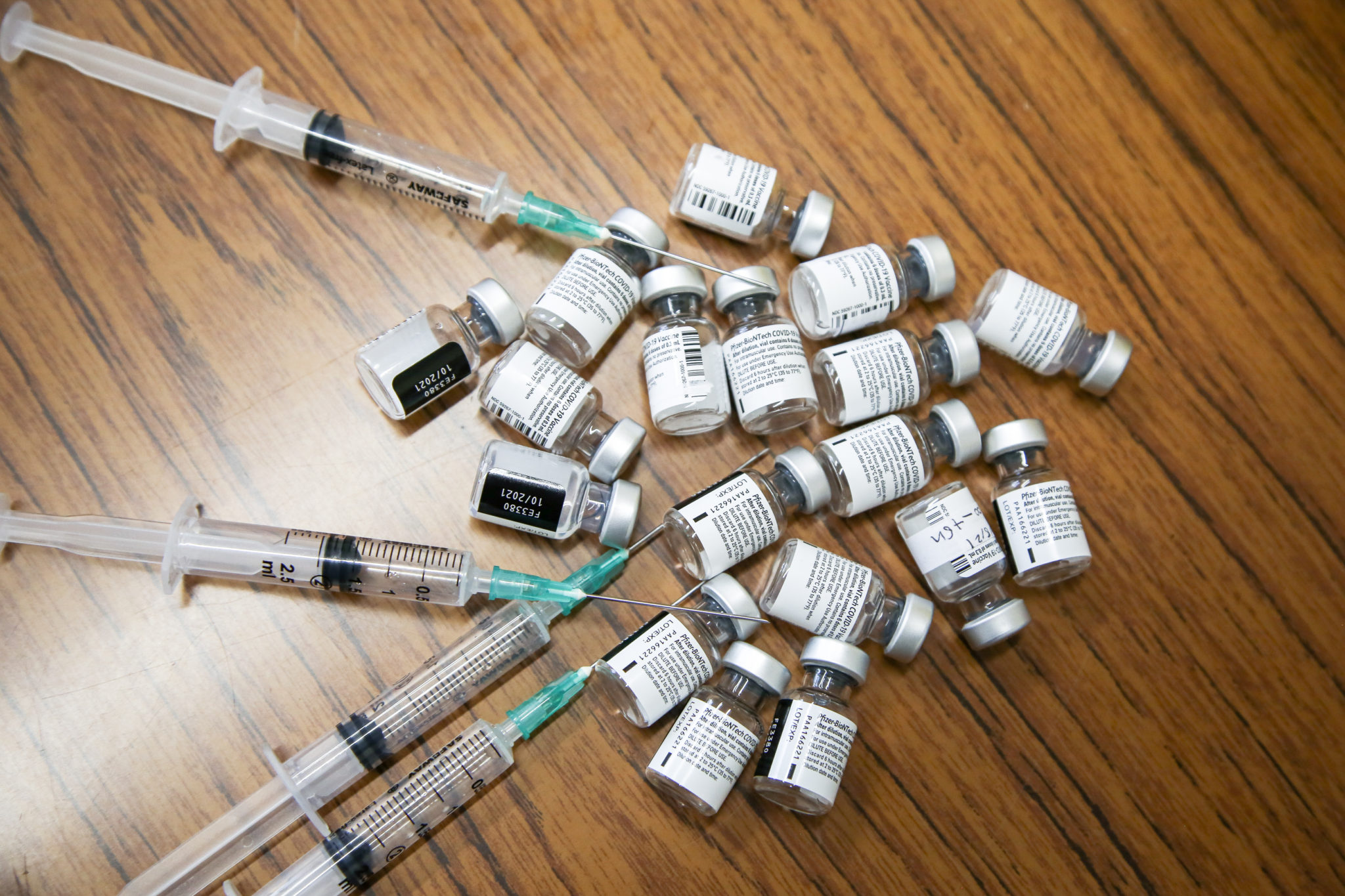 Vials of Pfizer Covid-19 vaccine and syringes at a vaccination center