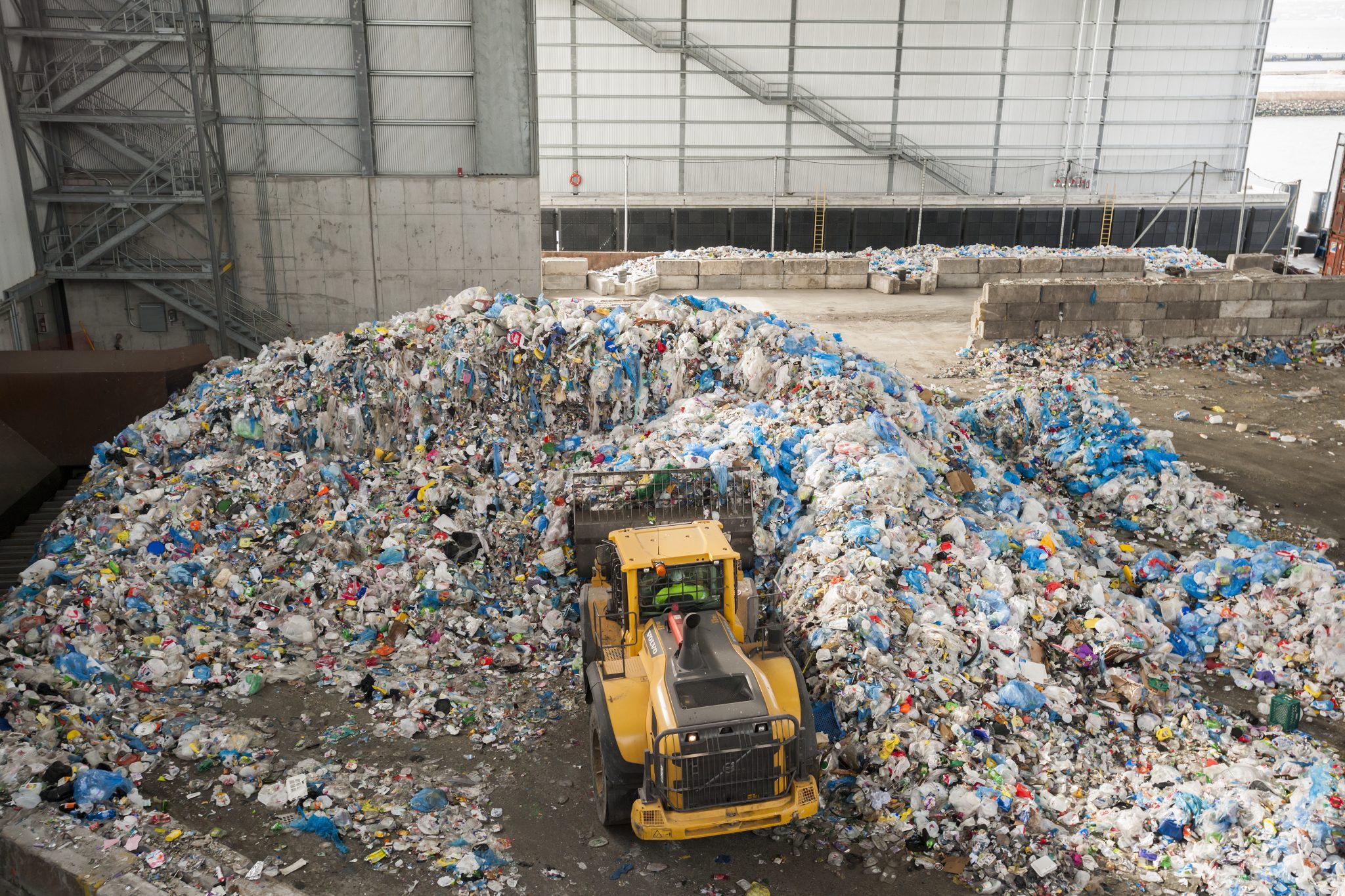 A front loader moves rubbish in the tipping area of a New York curbside recycling program in the US in January 2015.