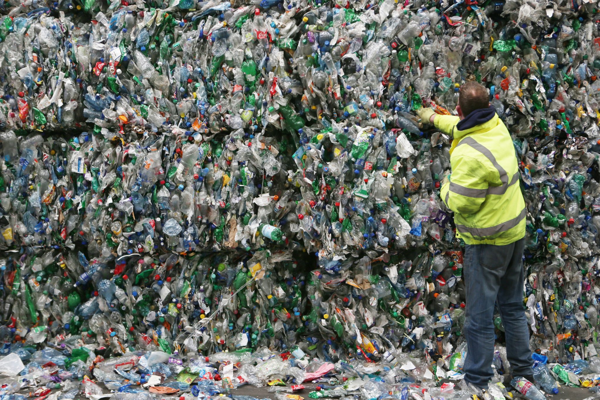 A worker checks the mountains of plastic bottles compressed into blocks at the Panda Recycling plant in Dublin, 30-04-2018. Image: RollingNews