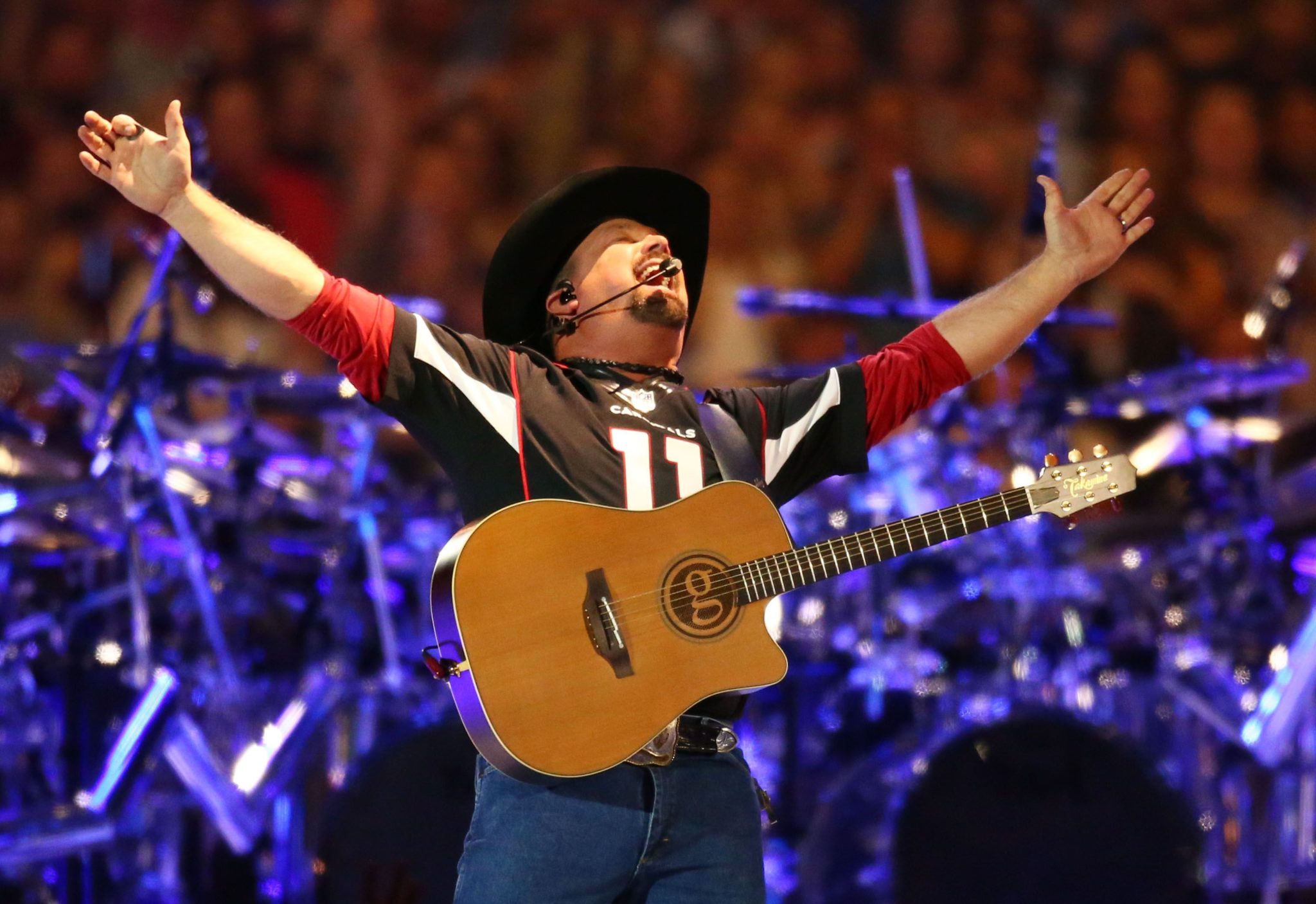 Country music legend Garth Brooks performs to over 75,000 fans, the largest indoor concert crowd ever in Arizona at State Farm Stadium