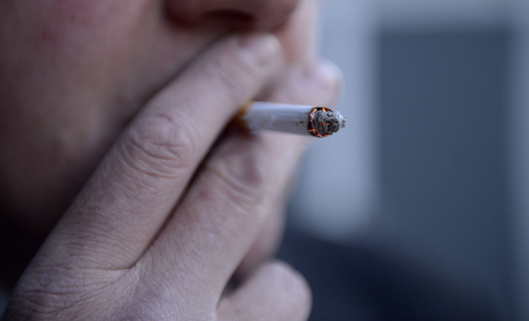 A man smoking a cigarette in this 2013 file photo