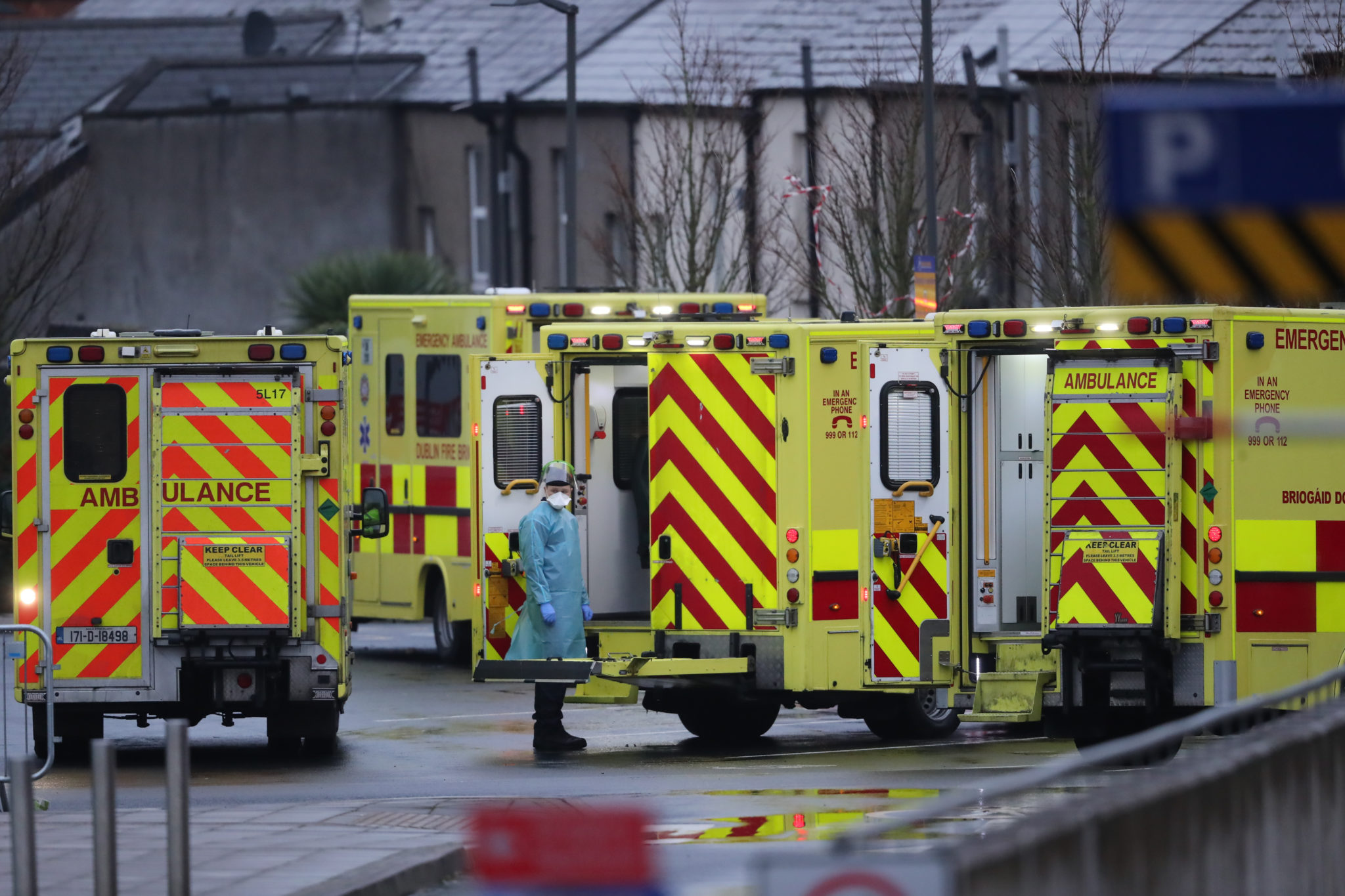 A medic in PPE and ambulances outside the Accident and Emergency department at the Mater Hospital in Dublin in January