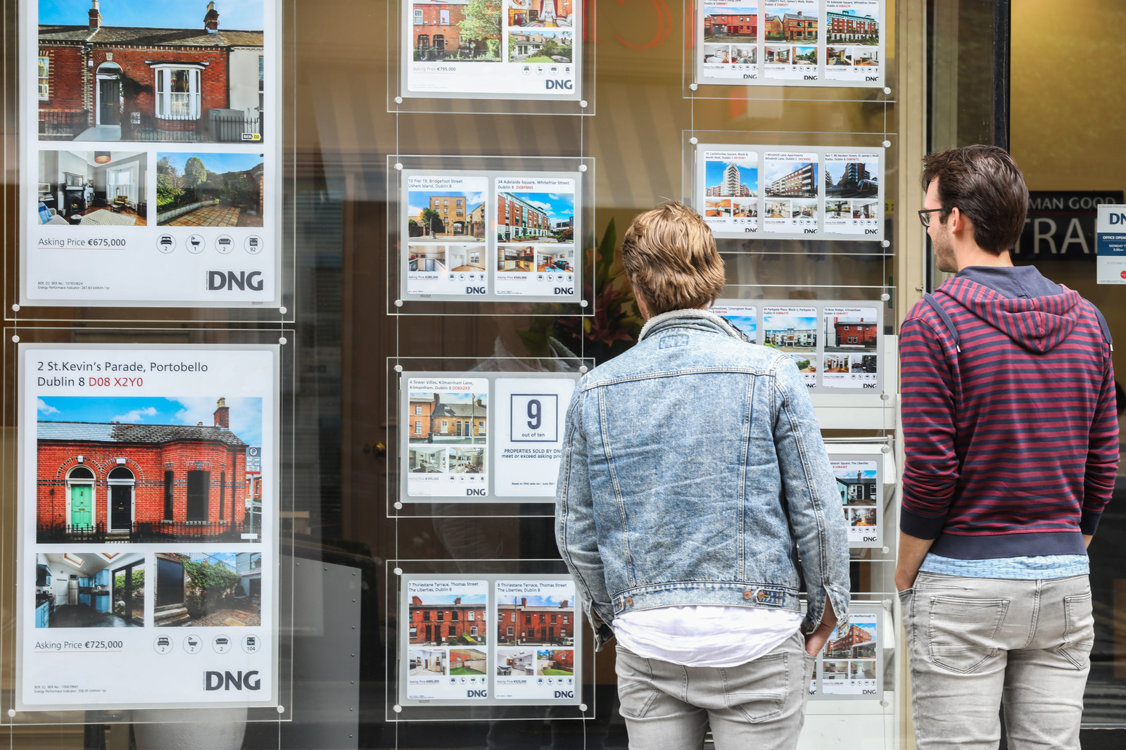 File photo shows members of the public viewing house prices in an auctioneers window in Dublin.