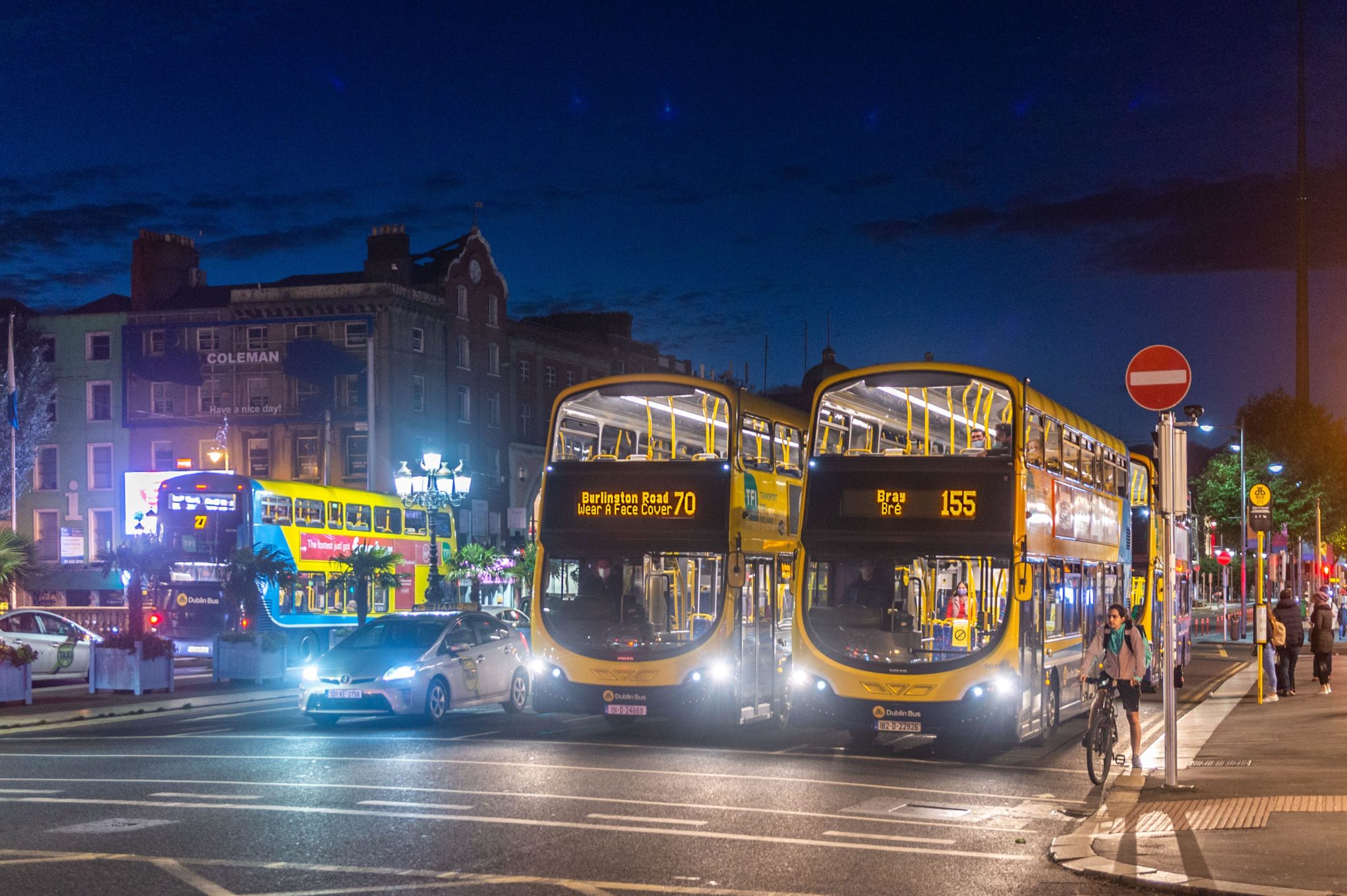 Dublin Buses on O'Connell Street Bridge in the city centre at night time in August 2020