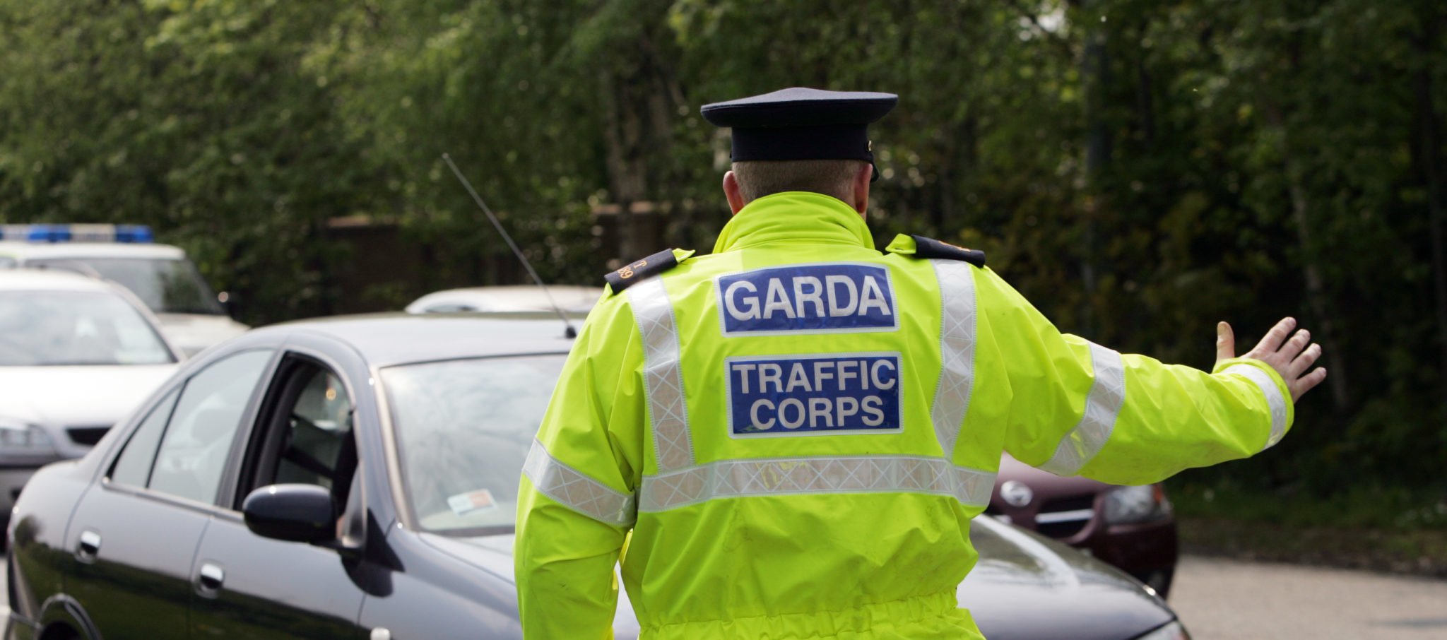 A Garda stops a car at a checkpoint on the N3 in Dublin in 2006.