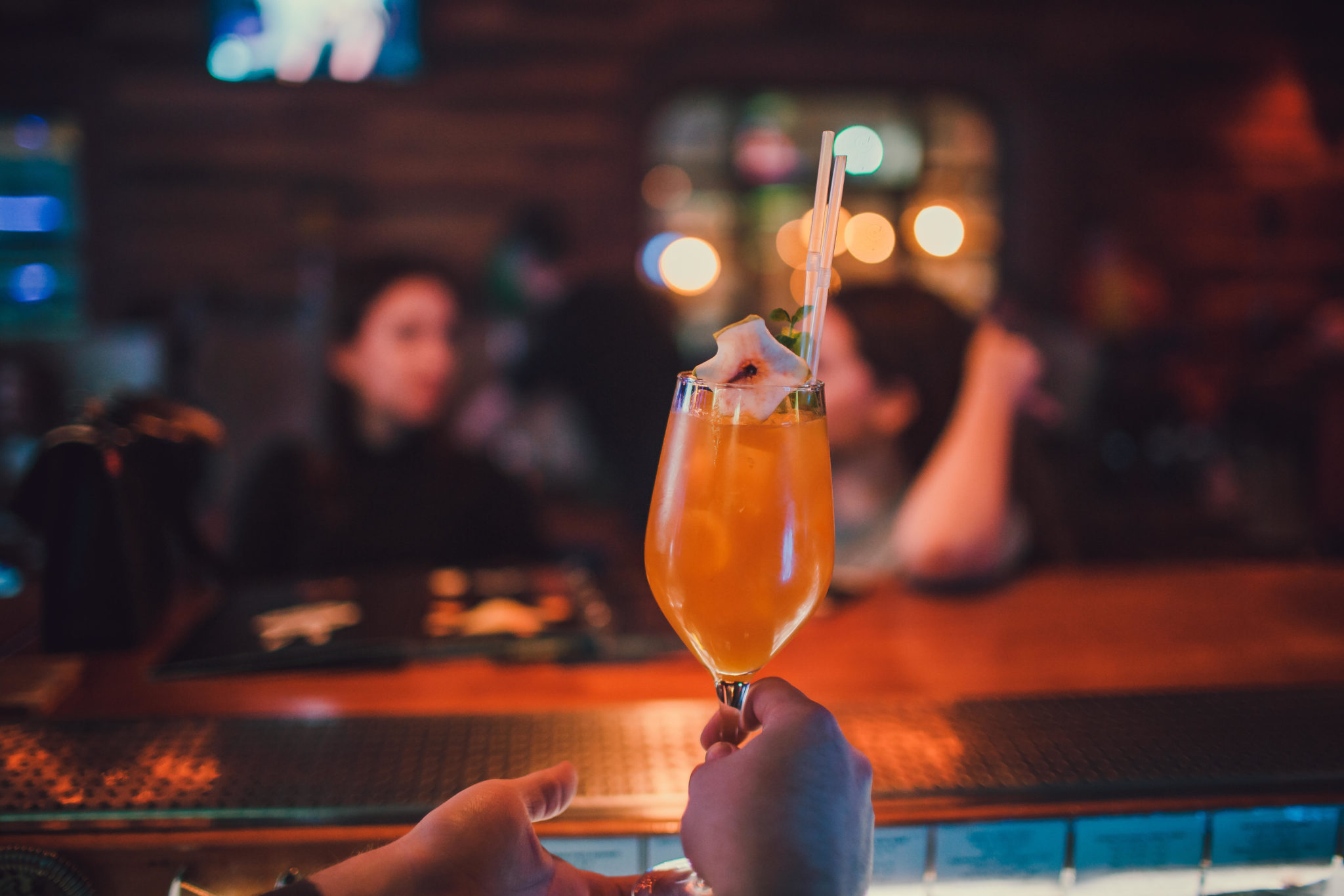 A barman gives a non-alcoholic cocktail across a hotel bar in November 2018