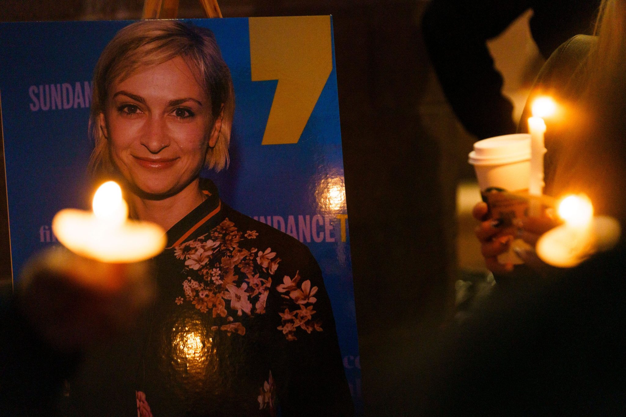 Members of a crowd hold up candles to remember Halyna Hutchins, after her death on the set of Rust, at the Albuquerque Civic Plaza in New Mexico in October 2021.