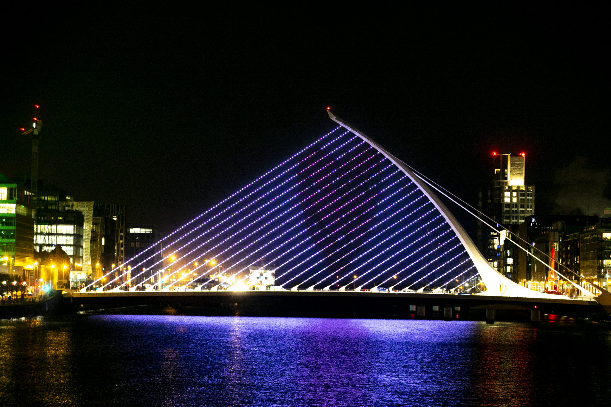 A projection of Adam King's Virtual Hug sign on the Samuel Beckett Bridge, Dublin in January 2021. 