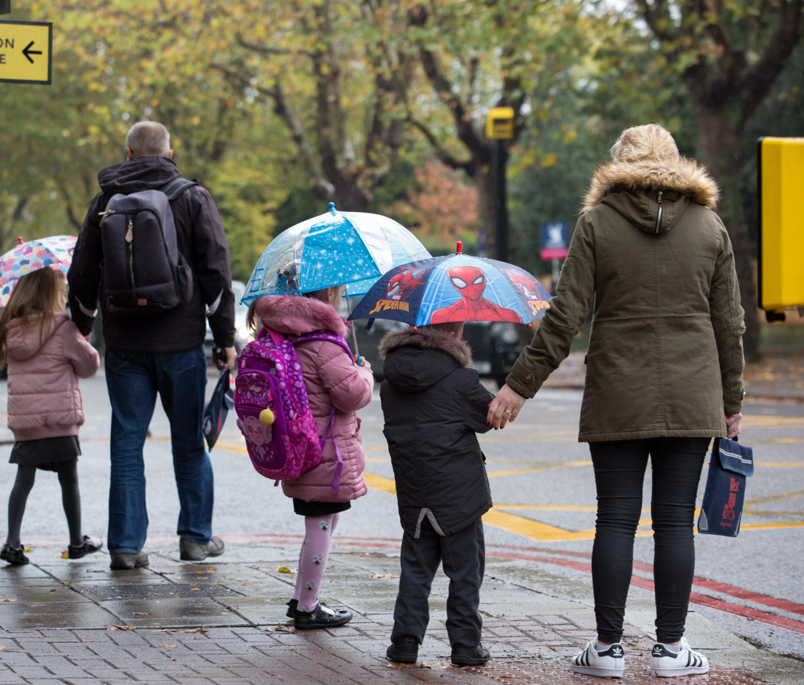 Children walking to school with their parents in London, England in November 2018.