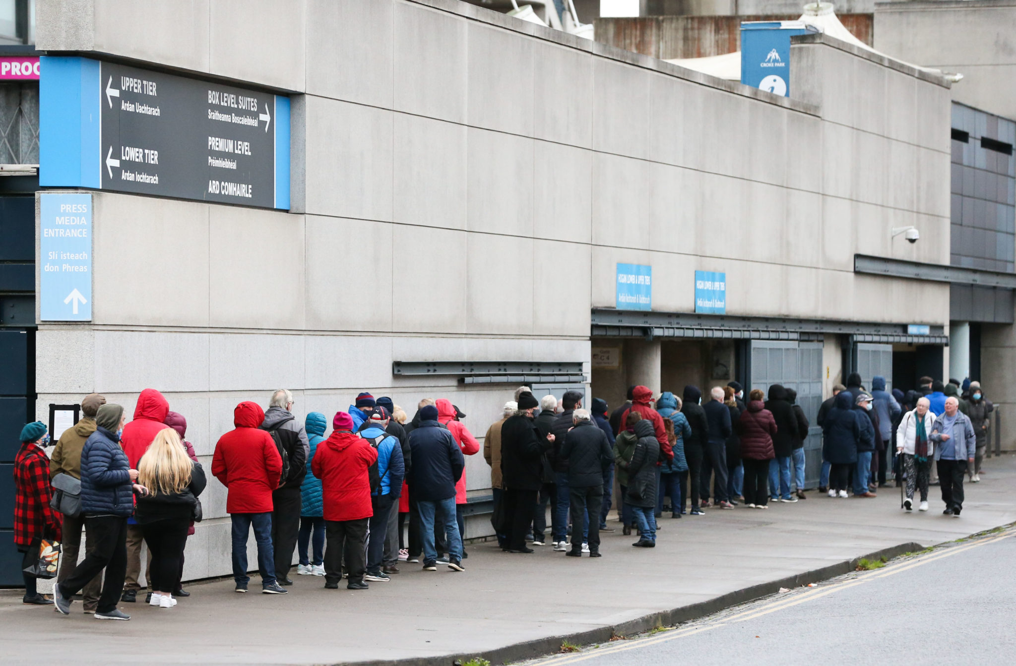 Main image shows long queues of people outside the Croke Park walk-in vaccine centre,