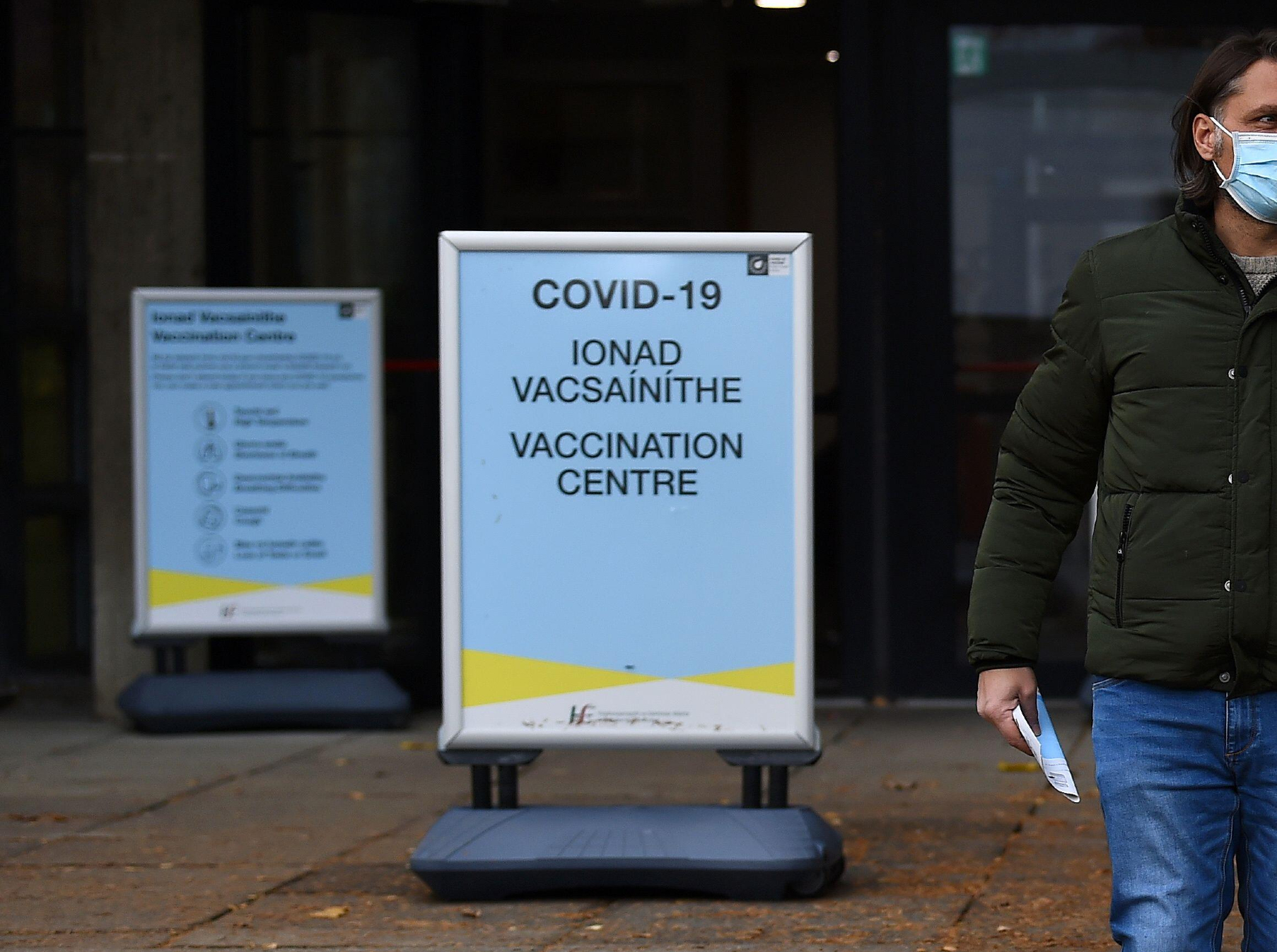 A man leaves after receiving his COVID-19 vaccine booster at the University College Dublin campus clinic.