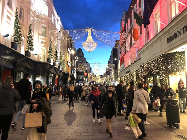 Shoppers under the Christmas lights on Grafton Street in Dublin